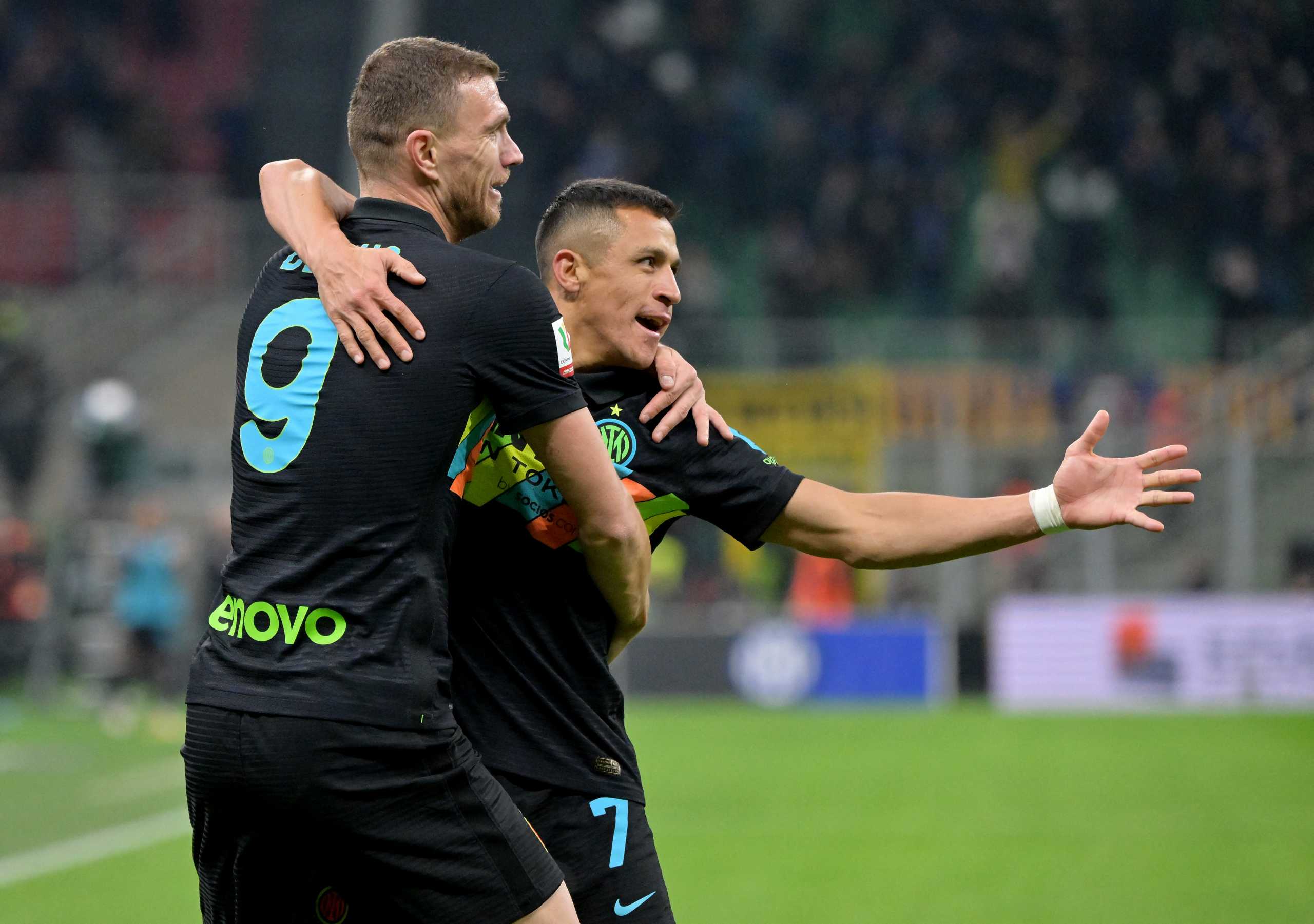 Soccer Football - Coppa Italia - Quarter-Final - Inter Milan v AS Roma - San Siro, Milan, Italy - February 8, 2022 Inter Milan's Alexis Sanchez celebrates scoring their second goal with teammate Edin Dzeko REUTERS