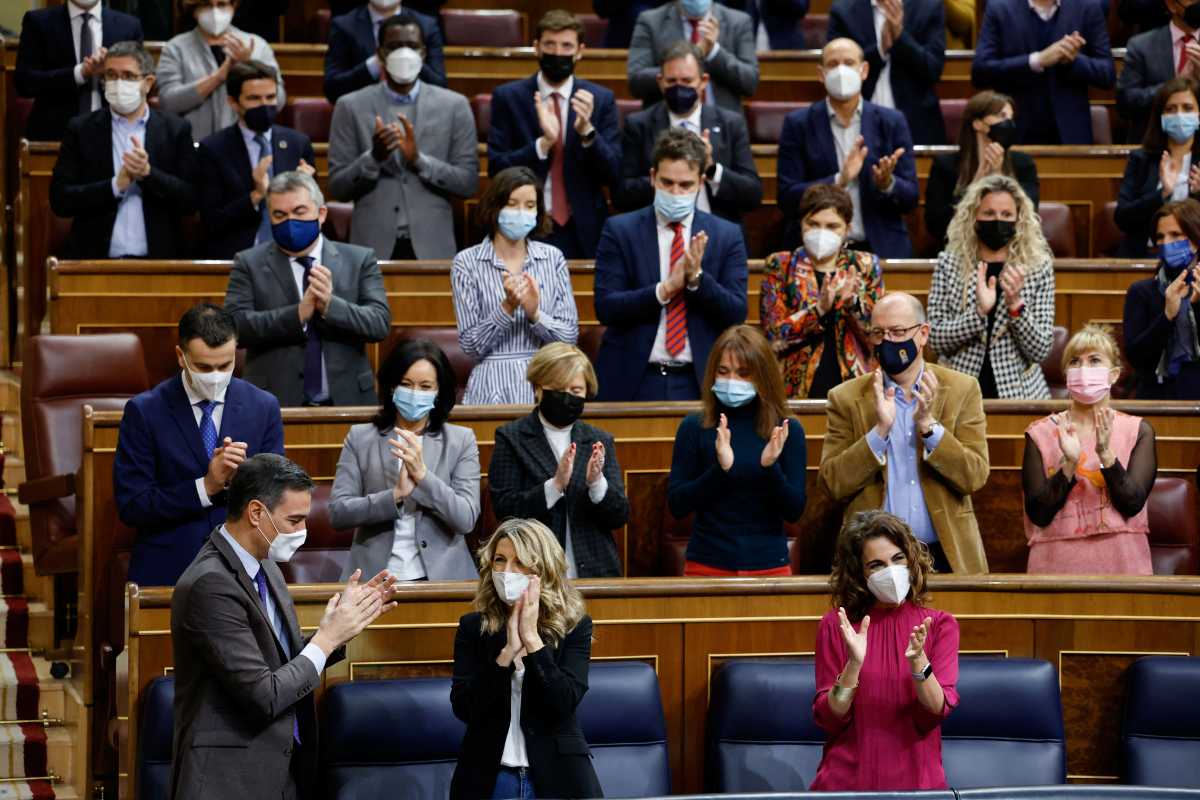 Spanish Labour Minister and Second Deputy Prime Minister Yolanda Diaz receives applause after her intervention by Spanish Prime Minister Pedro Sanchez, Spain's Finance Minister Maria Jesus Montero, and other parliamentarians during a session of the parliament in Madrid, Spain, February 3, 2022. REUTERS