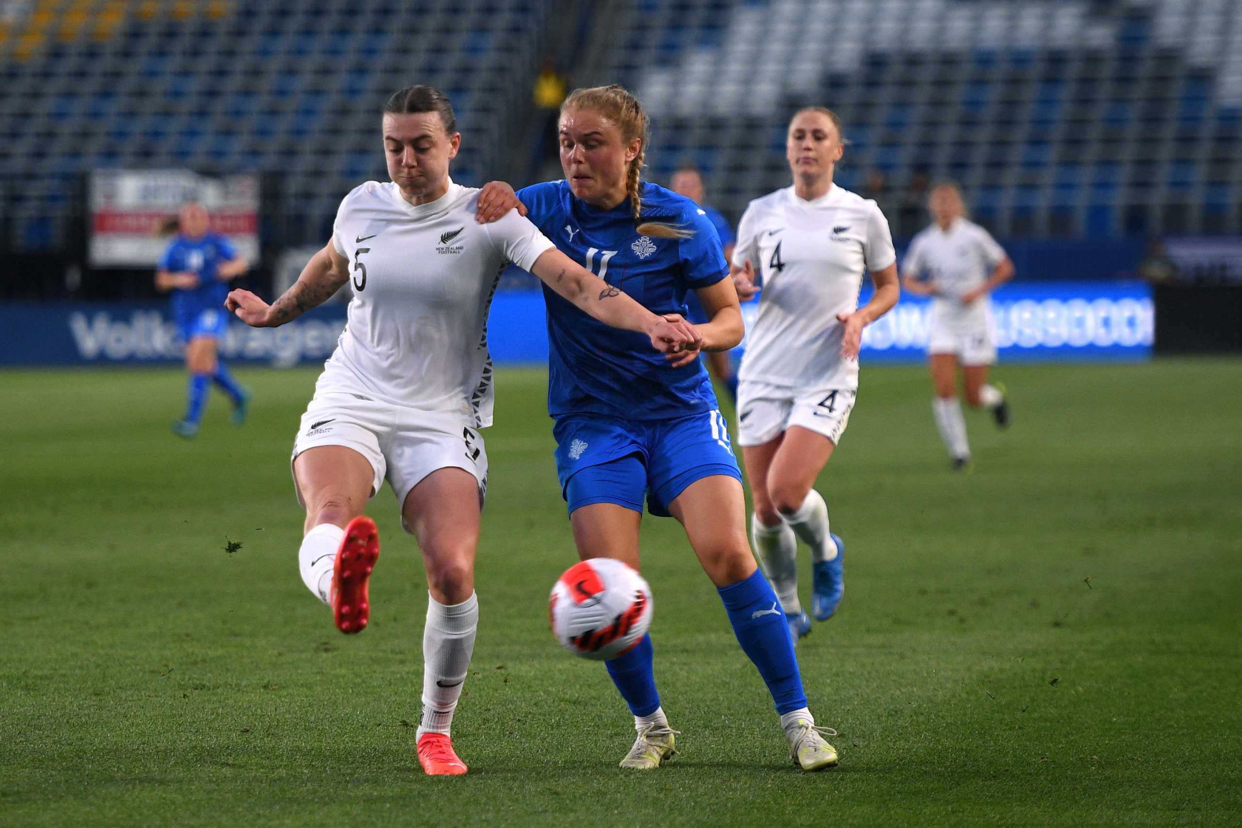 Feb 17, 2022; Carson, California, USA; New Zealand defender Meikayla Moore (5) clears the ball ahead of Iceland midfielder Agla María Albertsdottir (17) during the first half during a 2022 SheBelieves Cup international soccer match at Dignity Health Sports Park. Mandatory Credit: Orlando Ramirez-USA TODAY Sports