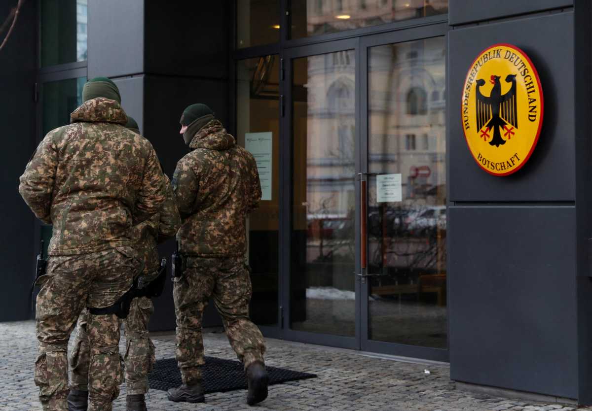 Members of the Ukrainian National Guard walk outside the German embassy in Kyiv, Ukraine February 12, 2022. REUTERS