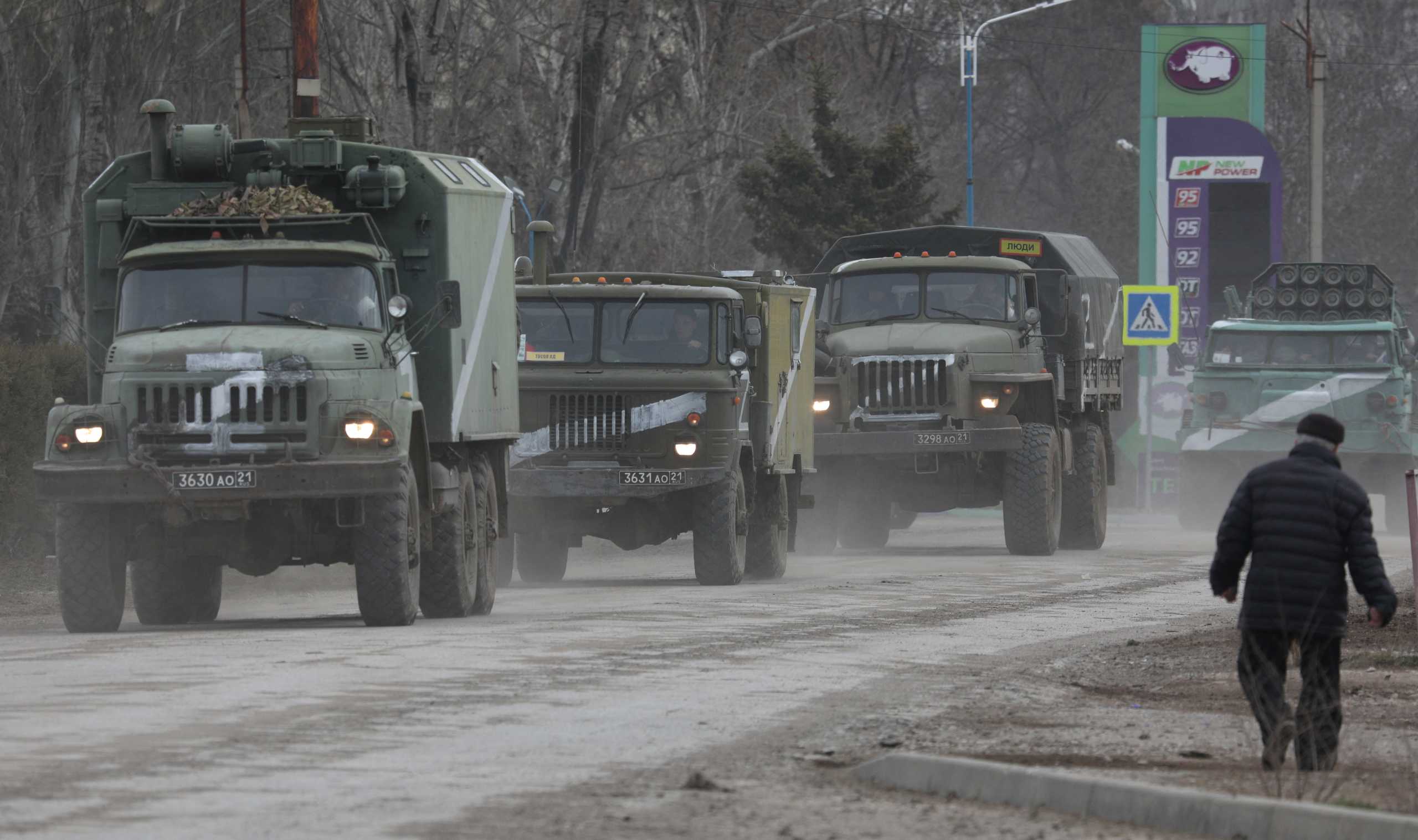 Russian Army military vehicles drive along a street, after Russian President Vladimir Putin authorized a military operation in eastern Ukraine, in the town of Armyansk, Crimea, February 24, 2022. REUTERS