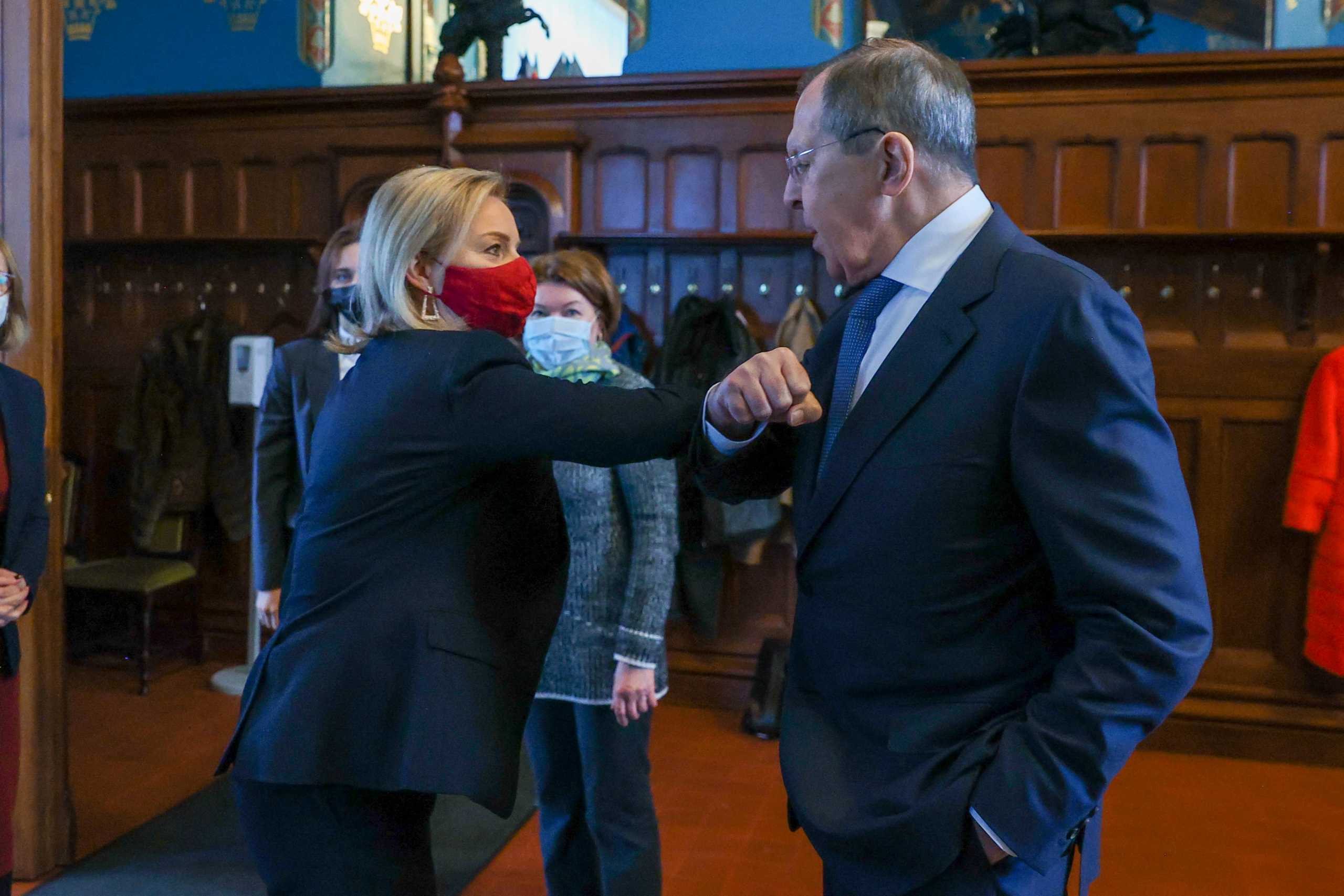 Russian Foreign Minister Sergei Lavrov greets British Foreign Secretary Liz Truss during a meeting in Moscow, Russia February 10, 2022. Russian Foreign Ministry
