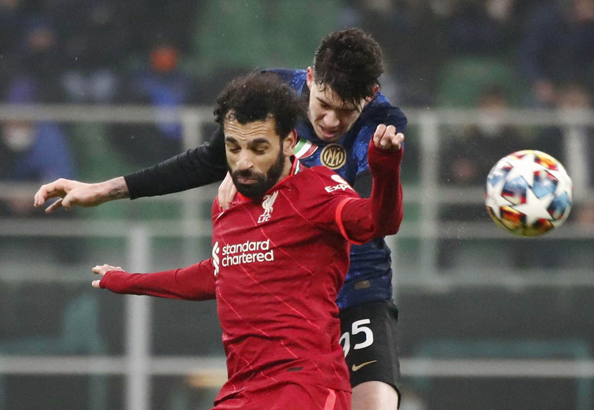 Soccer Football - Champions League - Round of 16 First Leg - Inter Milan v Liverpool - San Siro, Milan, Italy - February 16, 2022 Liverpool's Mohamed Salah in action with Inter Milan's Alessandro Bastoni REUTERS