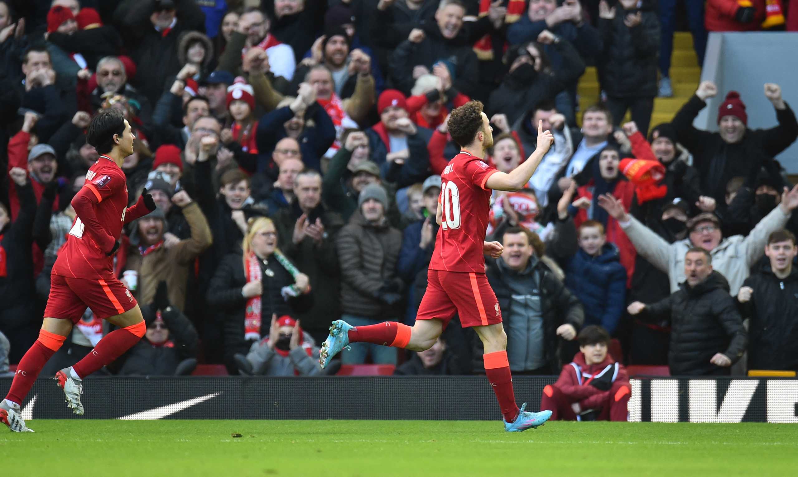 Soccer Football -  FA Cup - Fourth Round - Liverpool v Cardiff City - Anfield, Liverpool, Britain - February 6, 2022 Liverpool's Diogo Jota celebrates scoring their first goal with Takumi Minamino REUTERS