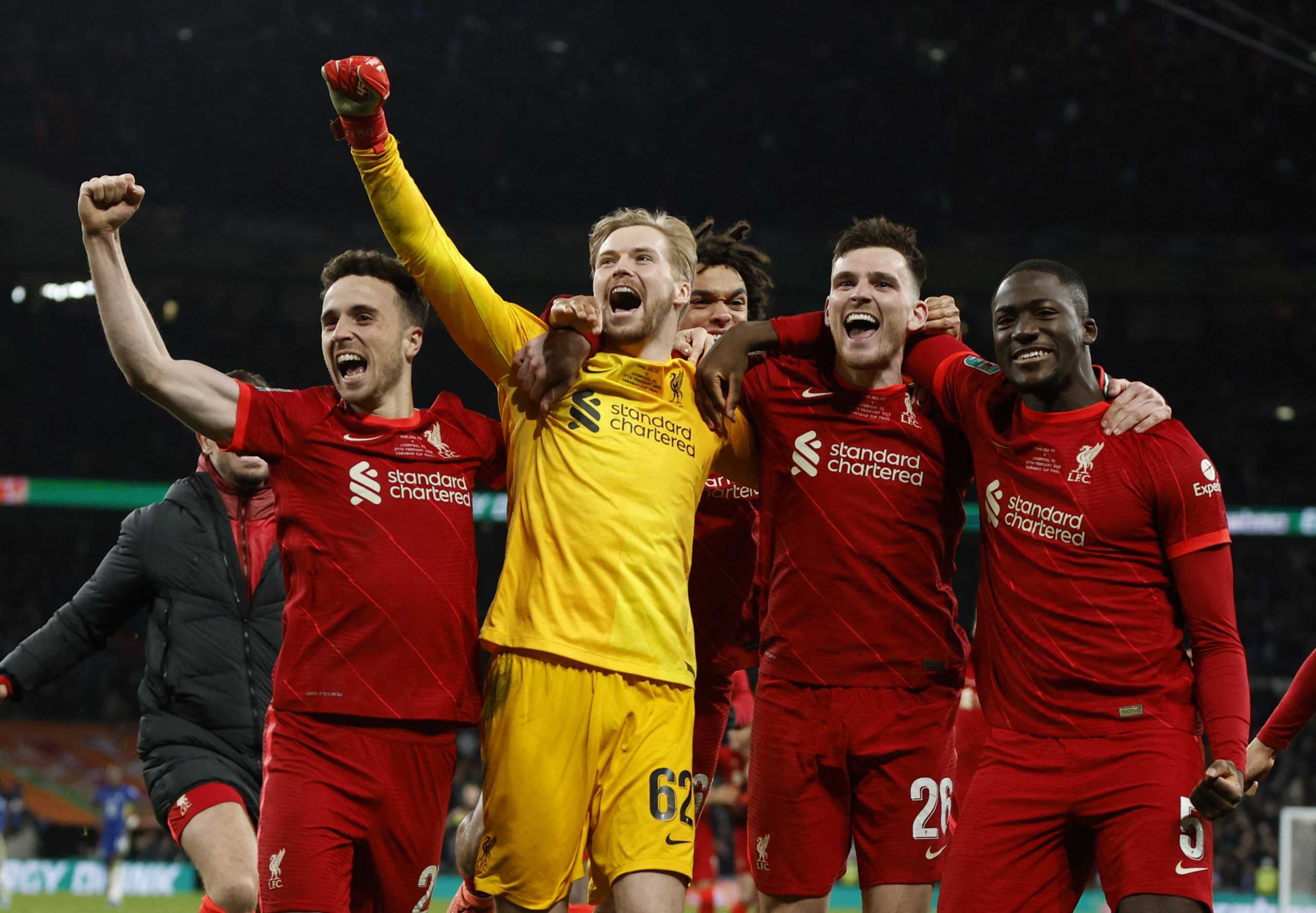 Soccer Football - Carabao Cup Final - Chelsea v Liverpool - Wembley Stadium, London, Britain - February  27, 2022  Liverpool's Caoimhin Kelleher with teammates celebrate after winning the penalty shoot-out Action Images via Reuters
