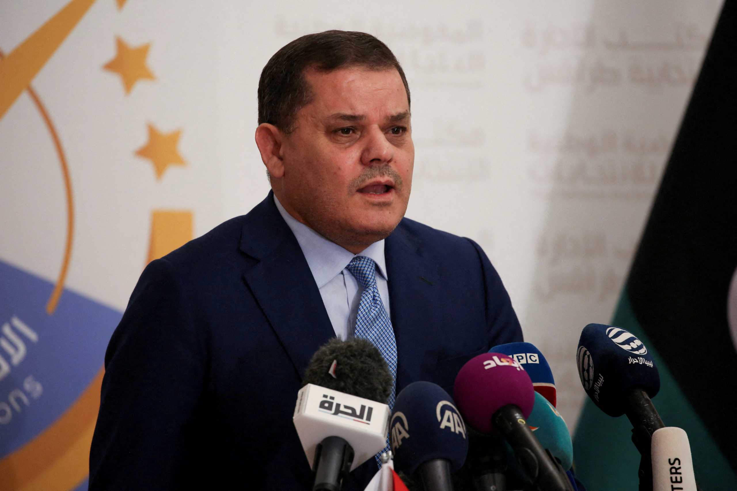 FILE PHOTO: FILE PHOTO: Libyan Prime Minister Abdulhamid al-Dbeibah speaks after submitting his candidacy papers for the upcoming presidential election at the headquarters of the electoral commission in Tripoli, Libya November 21, 2021. REUTERS