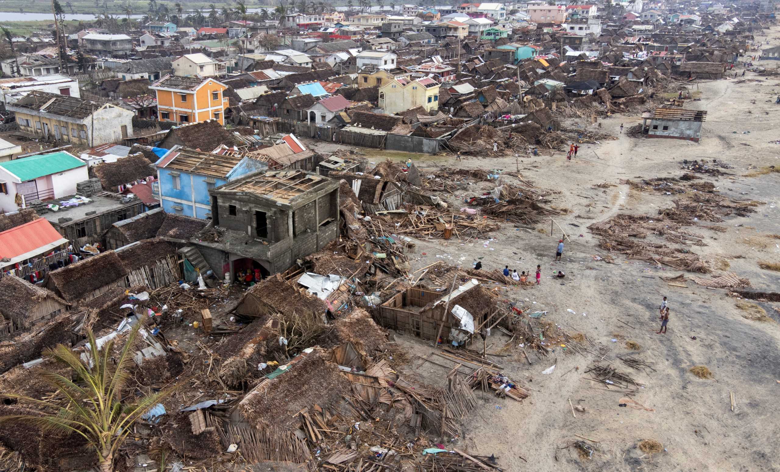 An aerial view shows damaged houses and debris on the beach, in the aftermath of Cyclone Batsirai, in Mananjary, Madagascar, February 8, 2022. Picture taken with a drone. REUTERS