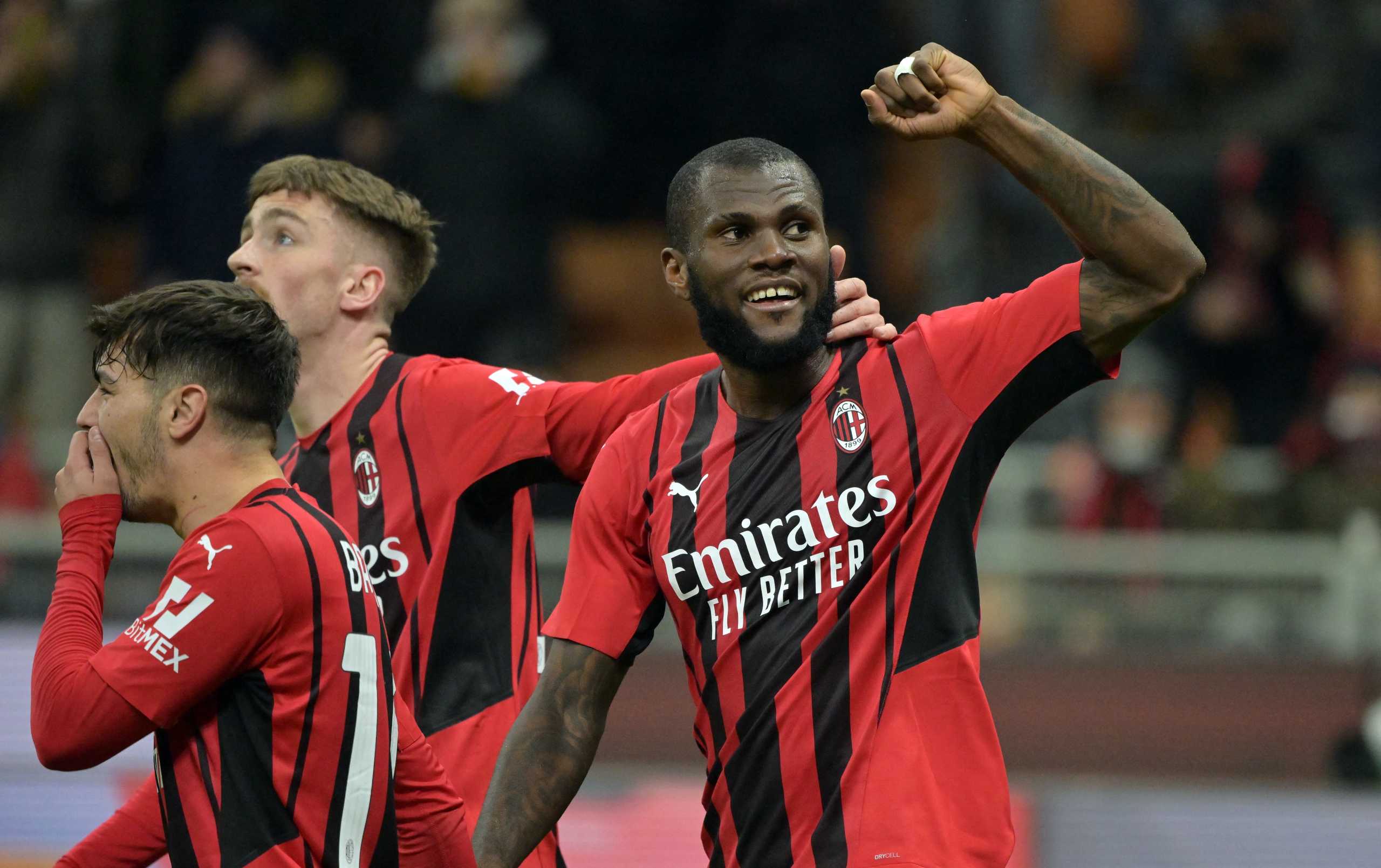 Soccer Football - Coppa Italia - Quarter Final - AC Milan v Lazio - San Siro, Milan, Italy - February 9, 2022 AC Milan's Franck Kessie celebrates scoring their fourth goal with Brahim Diaz and Alexis Saelemaekers REUTERS