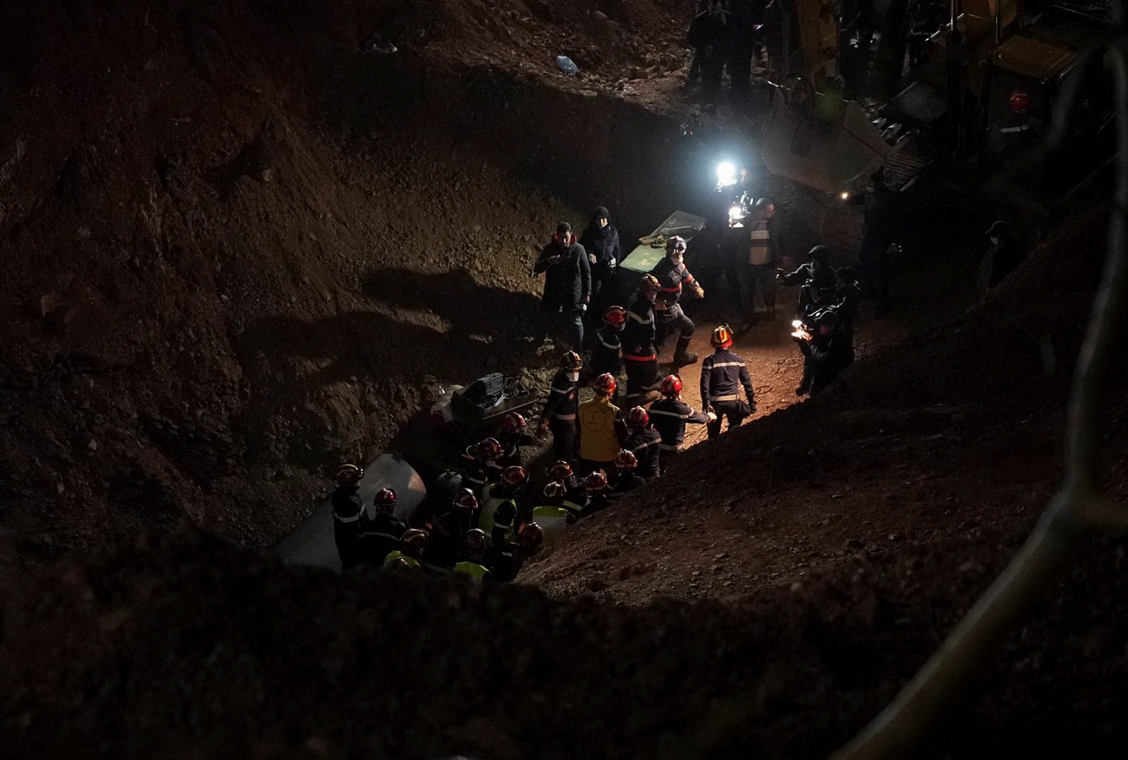 Rescue workers carry 5-year-old child, Rayan Awram, who has been trapped for five days in a well, to an ambulance, during a rescue operation near Chefchaouen, northern Morocco February 5, 2022,  February 5, 2022. REUTERS