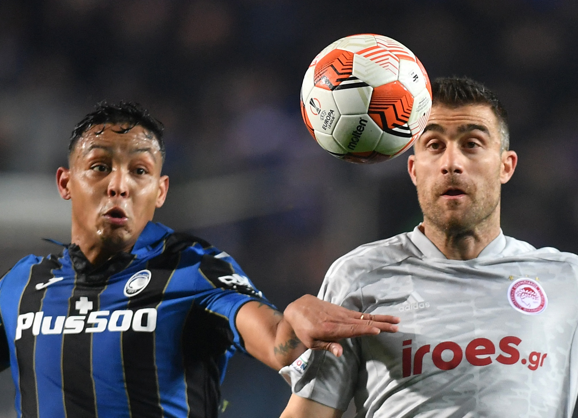 Soccer Football - Europa League - Play Off First Leg - Atalanta v Olympiacos - Stadio Atleti Azzurri, Bergamo, Italy - February 17, 2022 Olympiacos' Sokratis Papastathopoulos in action with Atalanta's Luis Muriel REUTERS
