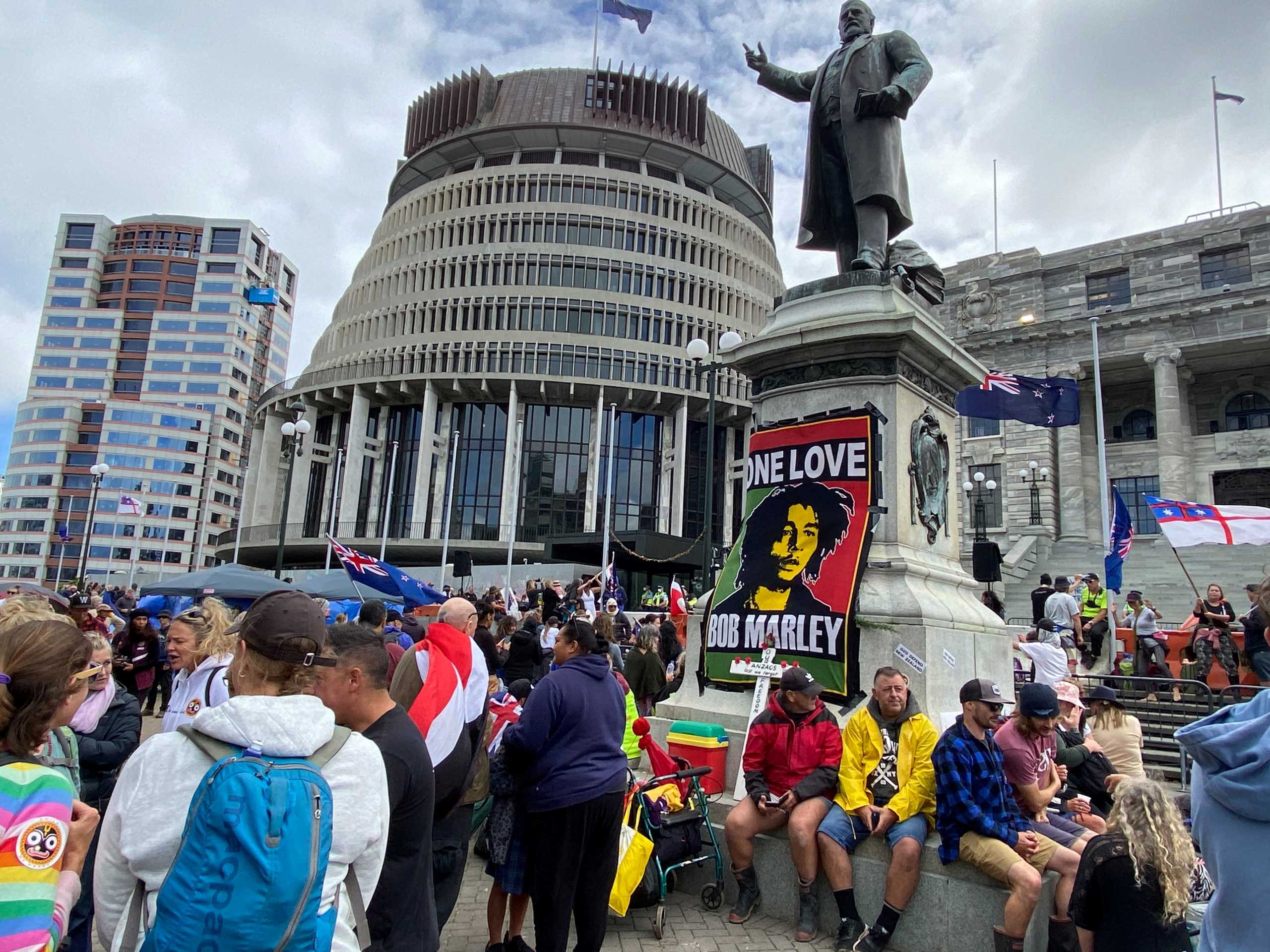 Protesters against the coronavirus disease (COVID-19) restrictions and vaccine mandates gather as they camp in front of the parliament in Wellington, New Zealand, February 14, 2022. REUTERS