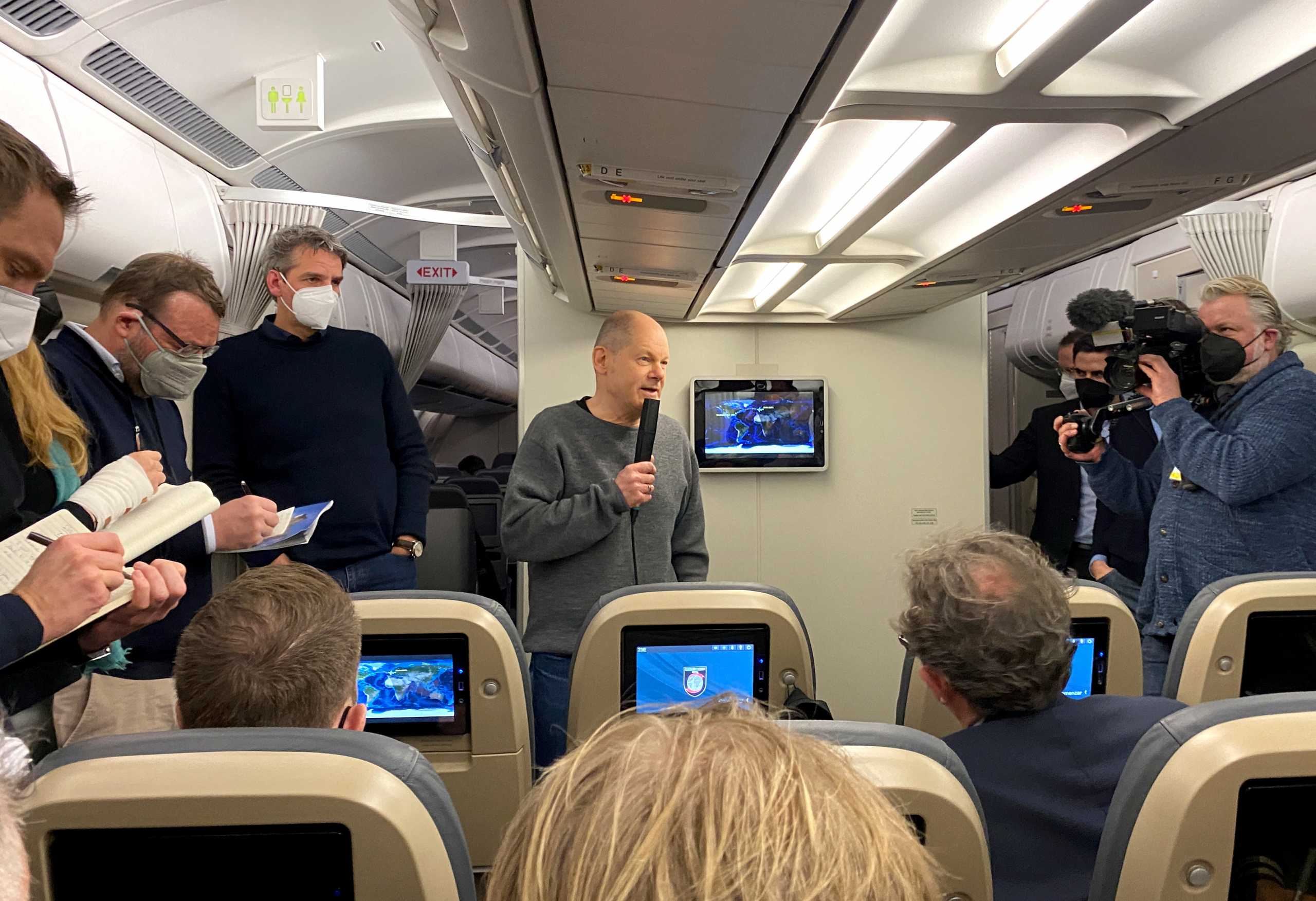 German Chancellor Olaf Scholz speaks to Reporters during an overnight flight to Washington to meet with U.S. President Joe Biden, departing from Berlin, Germany, February 6, 2022. Picture taken February 6, 2022.   REUTERS
