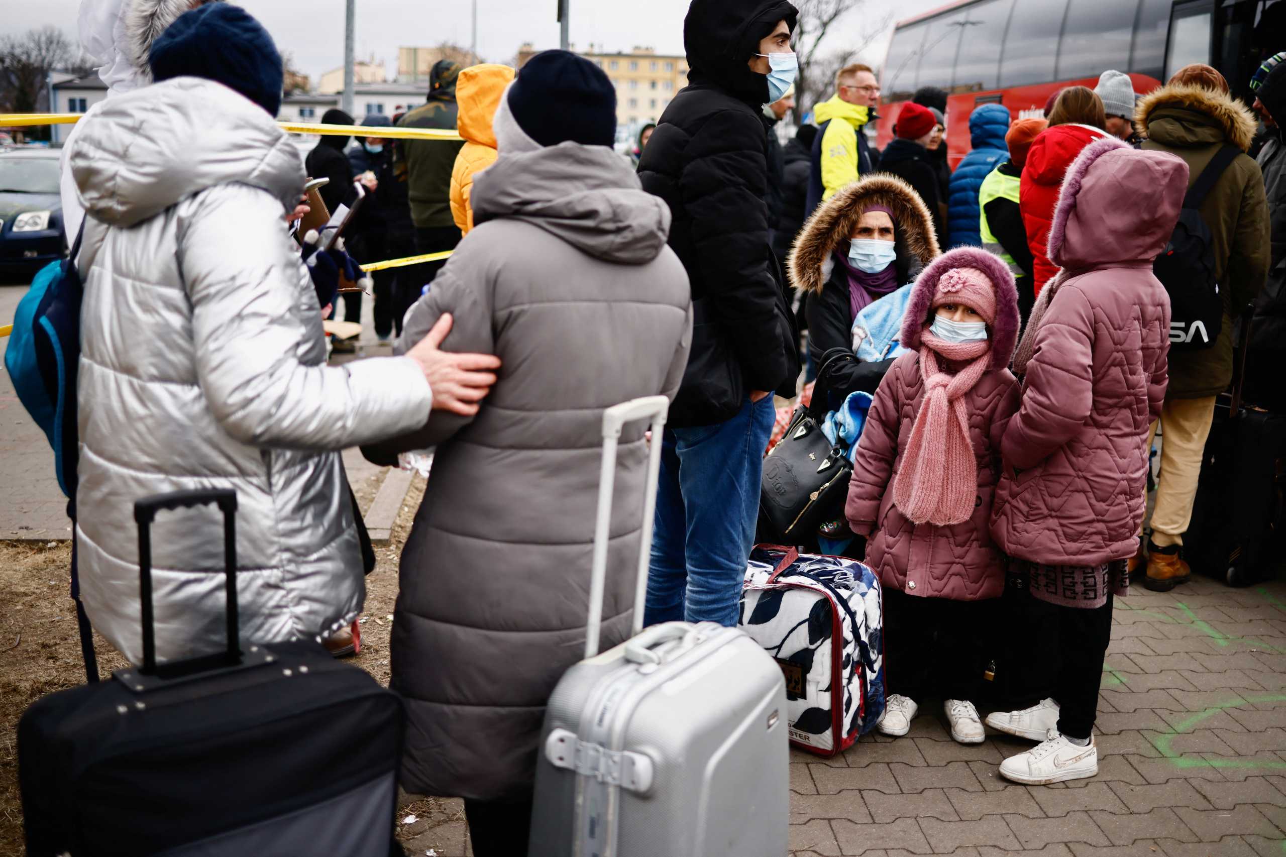 People fleeing Russian invasion of Ukraine stand at a temporary camp in Przemysl, Poland, February 28, 2022. REUTERS
