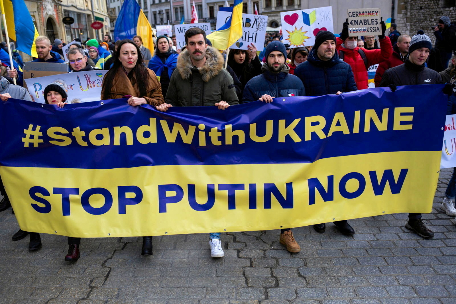 People march with a banner during a demonstration in solidarity with Ukraine in Krakow, Poland February 20, 2022. Adrianna Bochenek