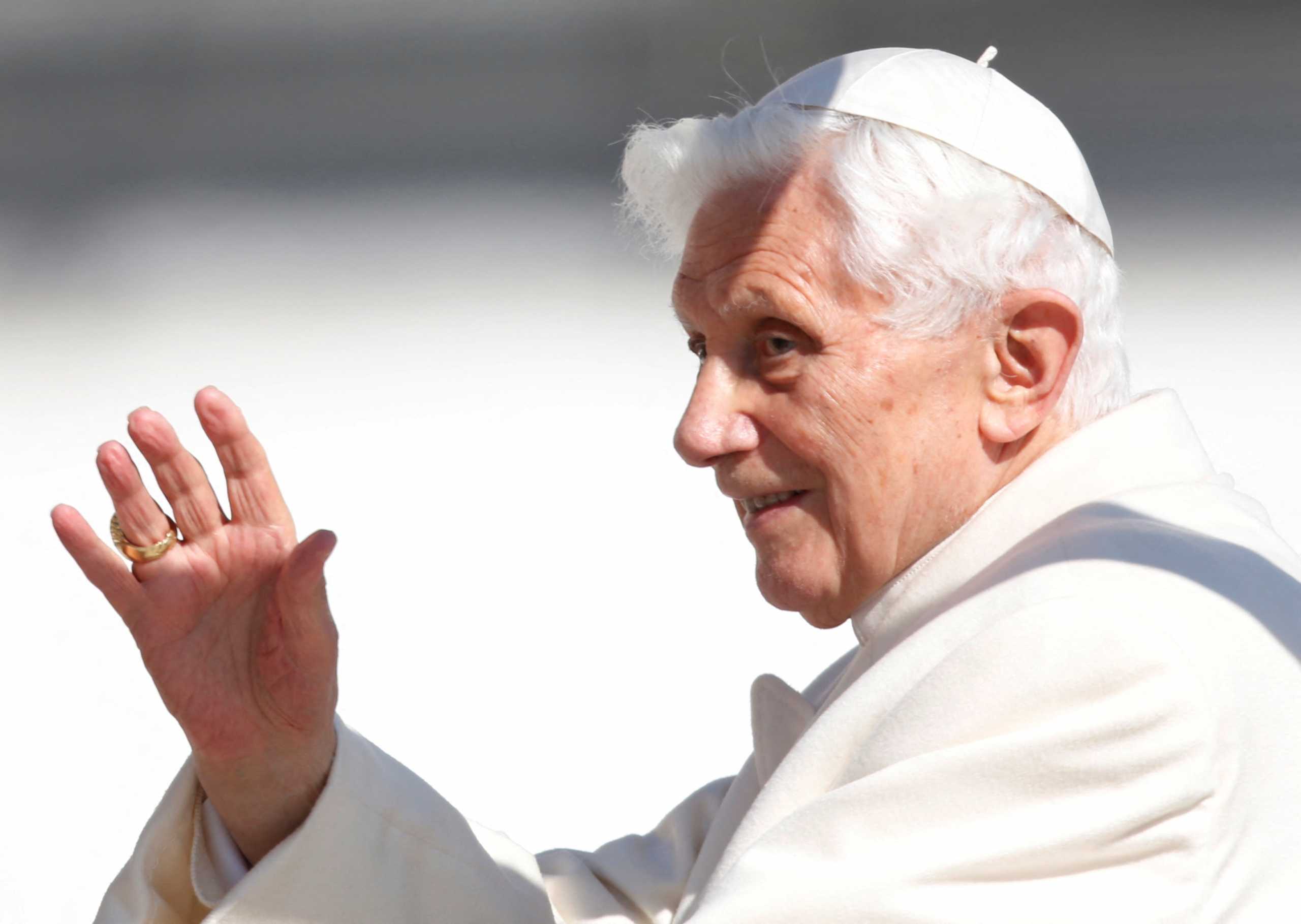 FILE PHOTO: Pope Benedict XVI waves to the faithful as he arrives in St Peter's Square to hold his last general audience at the Vatican February 27, 2013. REUTERS