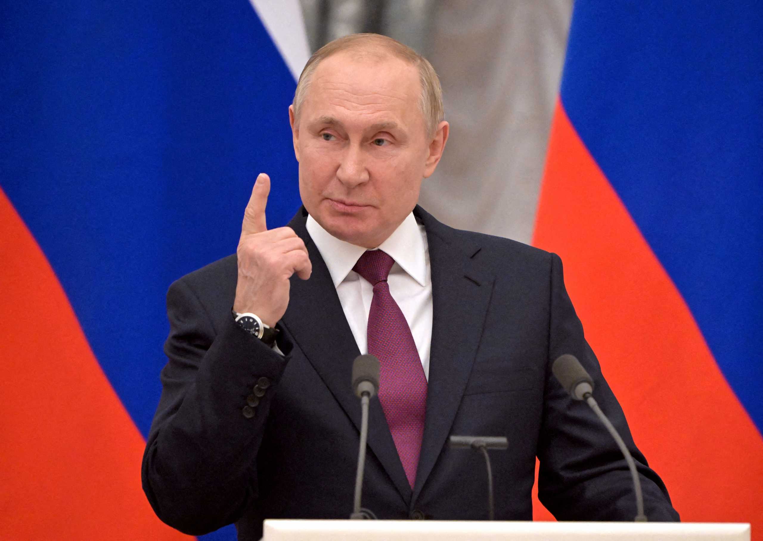 FILE PHOTO: Russian President Vladimir Putin gestures during a joint news conference with German Chancellor Olaf Scholz in Moscow, Russia February 15, 2022. Sputnik