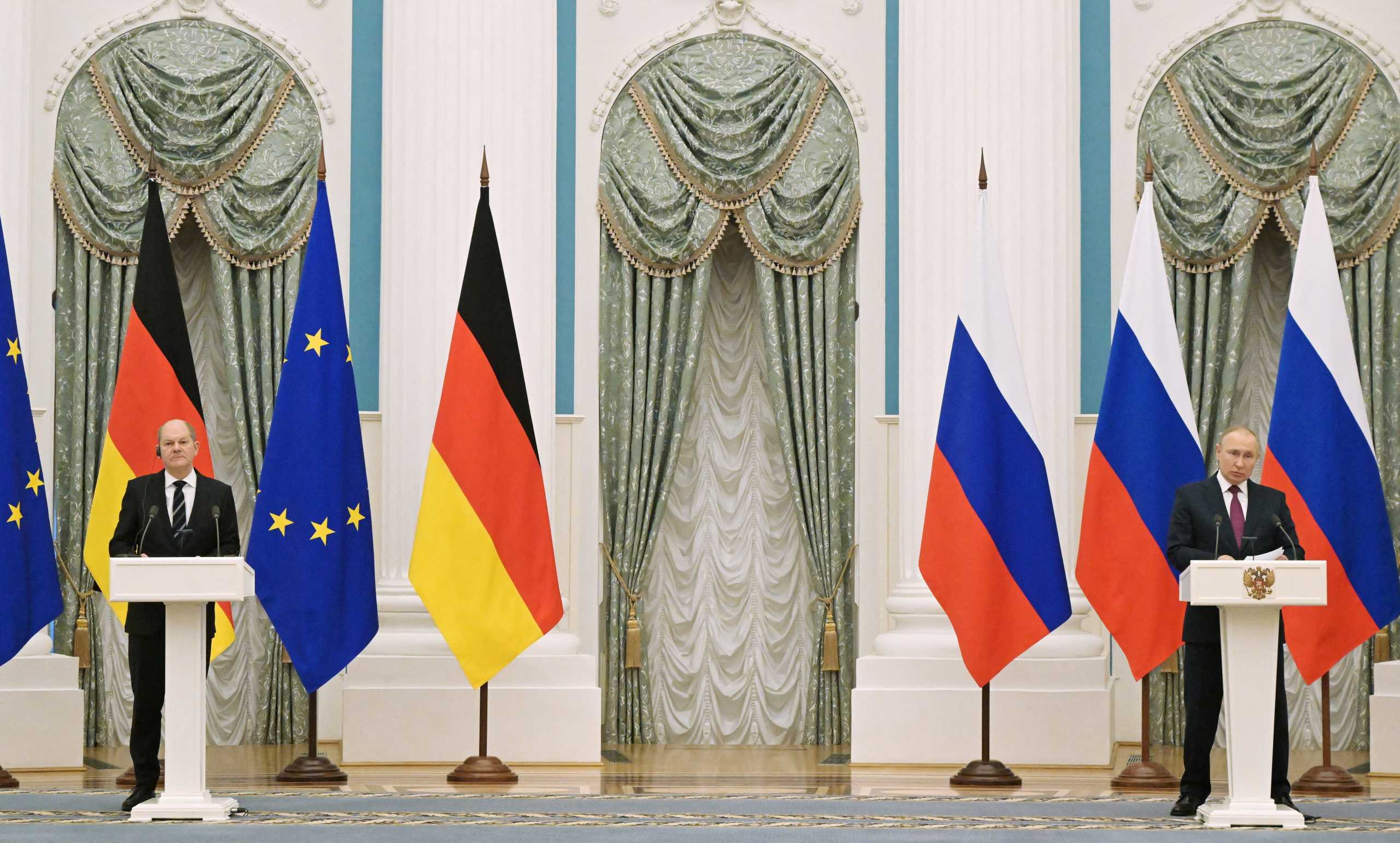 Russian President Vladimir Putin and German Chancellor Olaf Scholz attend a joint news conference in Moscow, Russia February 15, 2022. Sputnik