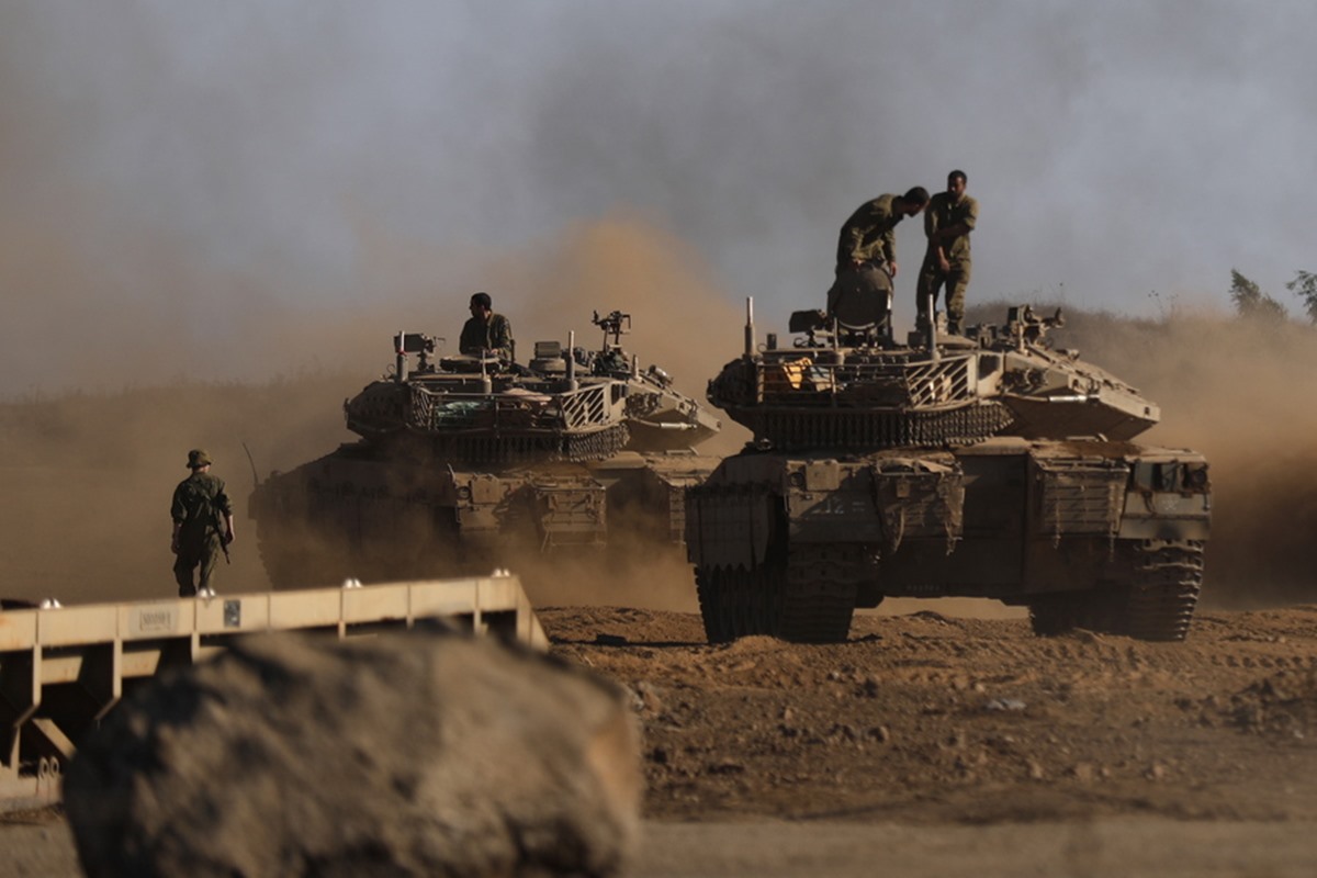 epa09418343 Israeli Merkava 4 tanks are seen during a military training in the annexed Golan Heights, next to the Israeli -Syrian border, 17 August 2021. Syrian official media sources said Israel targeted an army post near the Quneitra province with missiles. Israeli army did not comment on the incident.  EPA