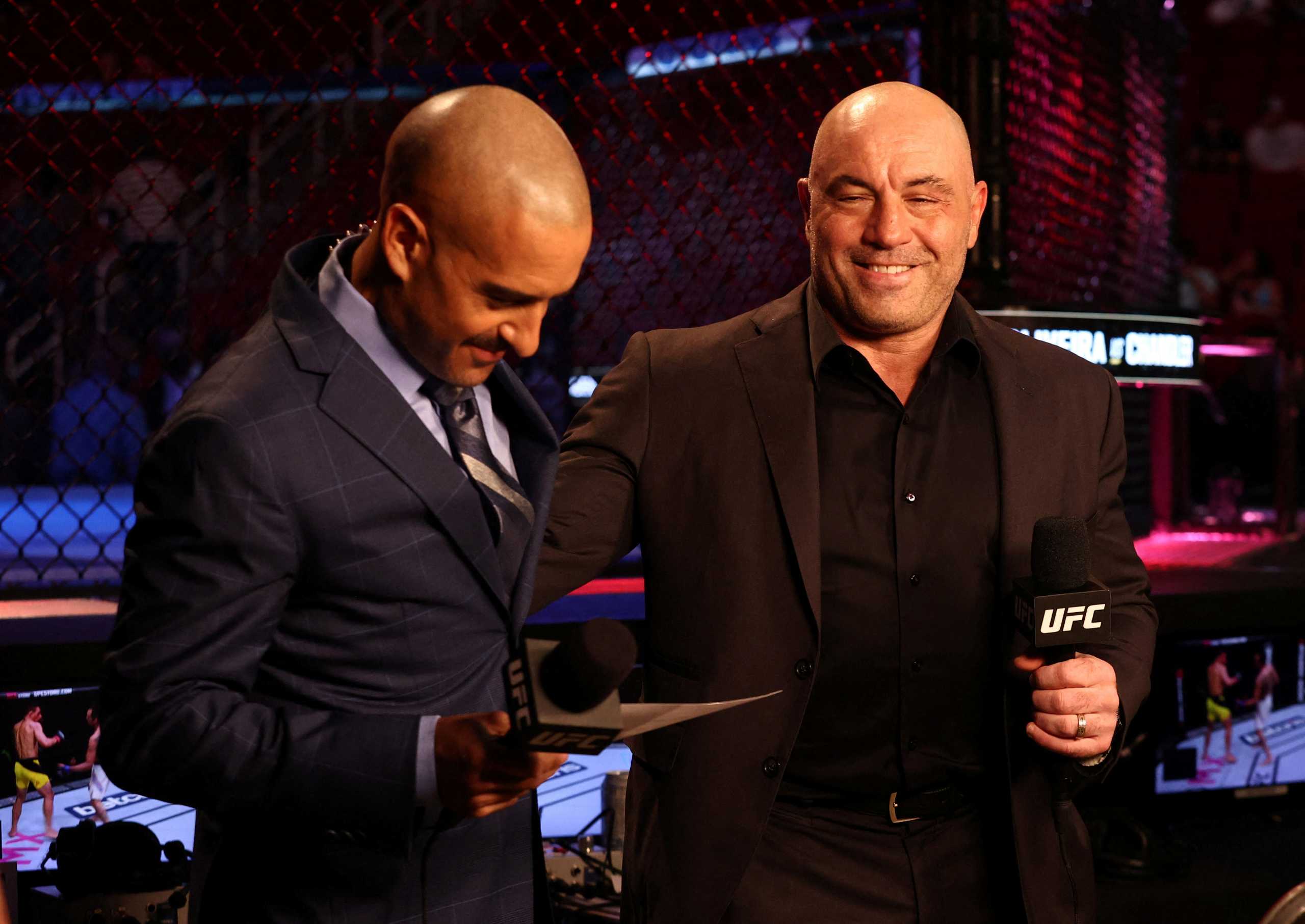 FILE PHOTO: May 15, 2021; Houston, Texas, USA; UFC ring announcer Joe Rogan (right) is interviewed before UFC 262 at Toyota Center. Mandatory Credit: Troy Taormina-USA TODAY Sports - 16090519