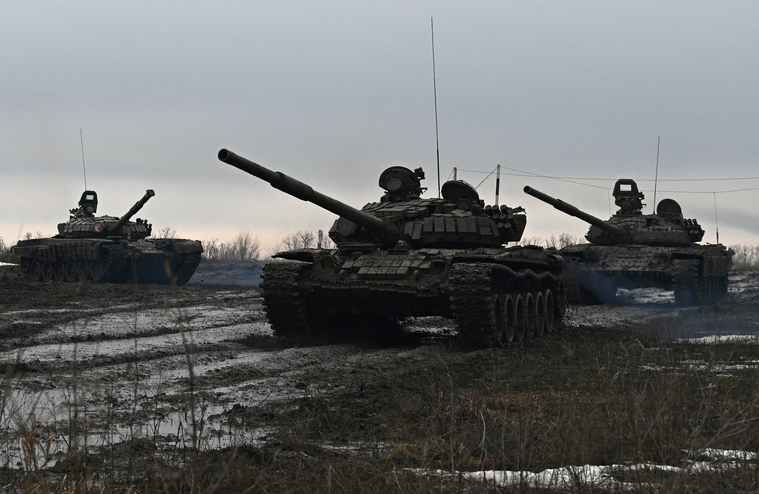 Russian service members drive tanks during drills held by the armed forces of the Southern Military District at the Kadamovsky range in the Rostov region, Russia February 3, 2022. REUTERS