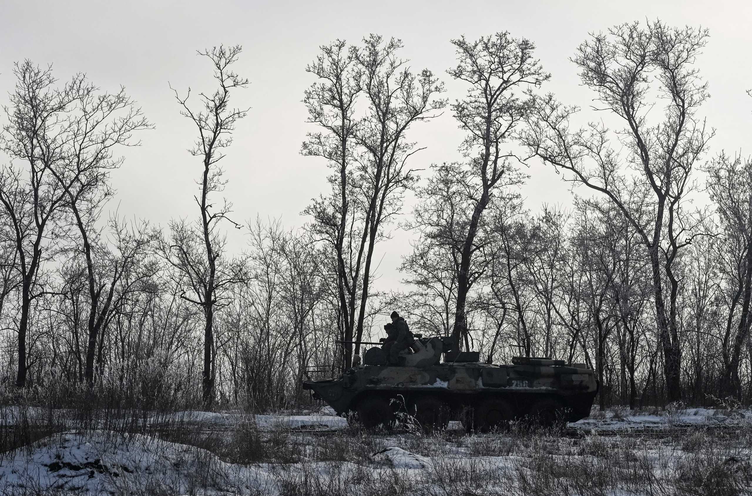 Russian army service members drive an armoured personnel carrier BTR-82 during drills at the Kuzminsky range in the southern Rostov region, Russia January 26, 2022. REUTERS