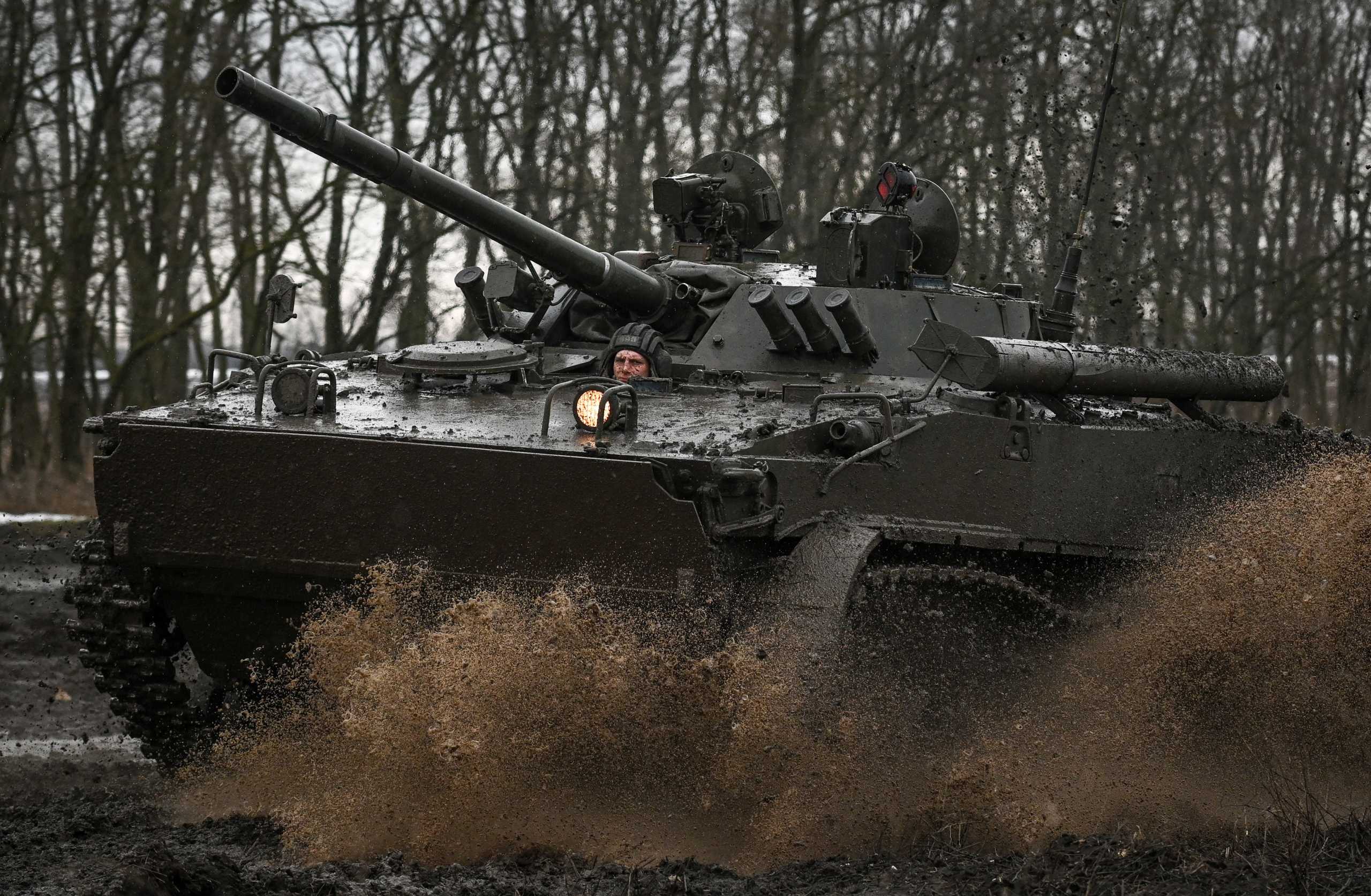 A Russian service member drives a BMP-3 infantry fighting vehicle during drills held by the armed forces of the Southern Military District at the Kadamovsky range in the Rostov region, Russia February 3, 2022. REUTERS