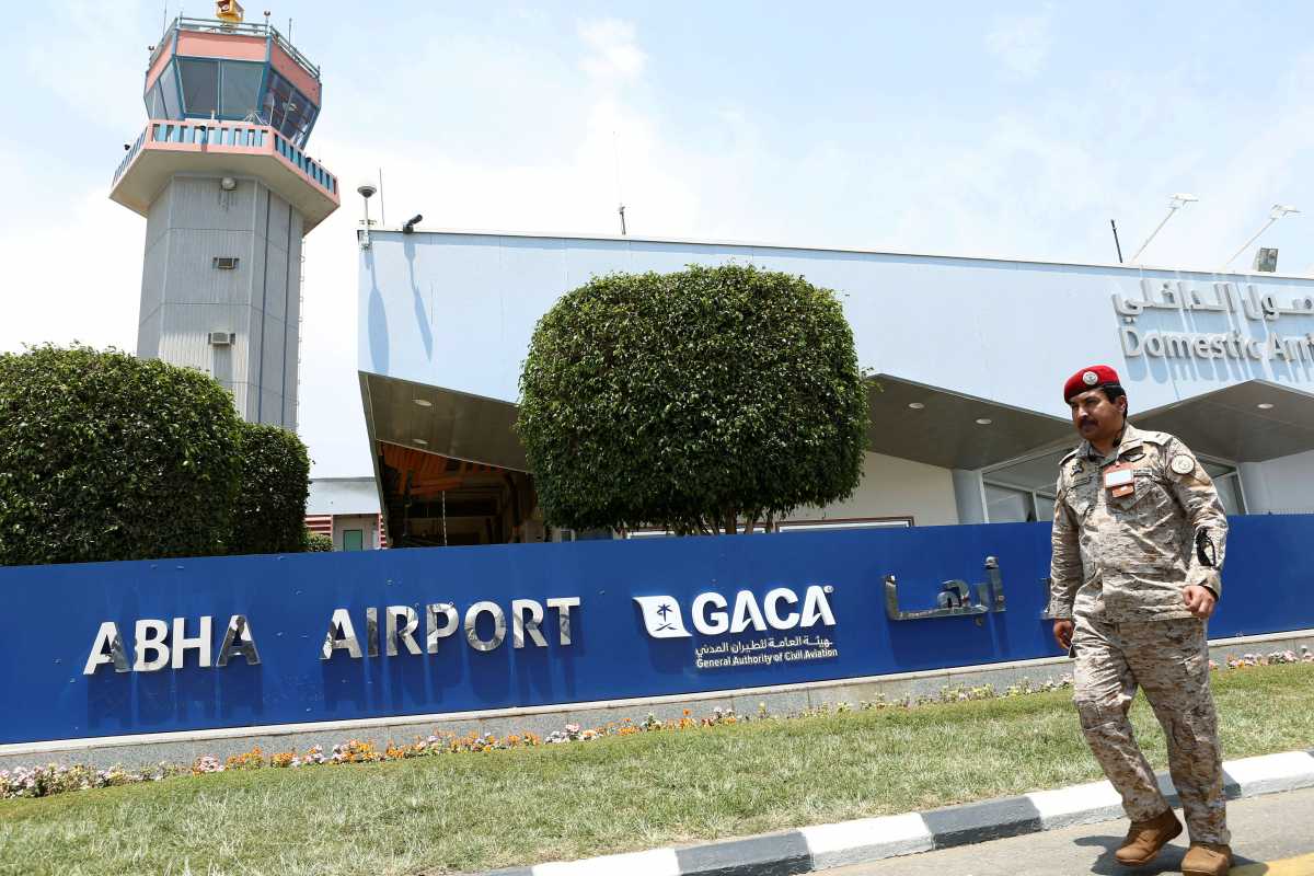 FILE PHOTO: A Saudi security officer walks past Saudi Arabia's Abha airport, June 13, 2019. REUTERS