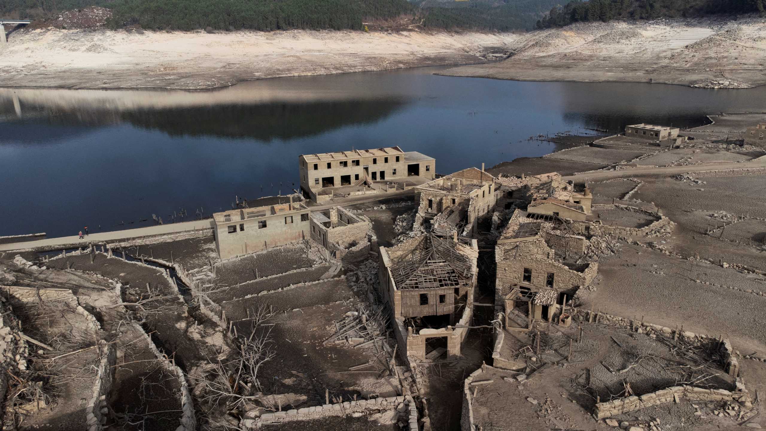 A general view shows the ancient village of Aceredo that had been submerged by Limia river in the 1990s after the dam was built in Concello de Lobios, Spain, February 10, 2022. Picture taken February 10, 2022. Picture taken with a drone. REUTERS