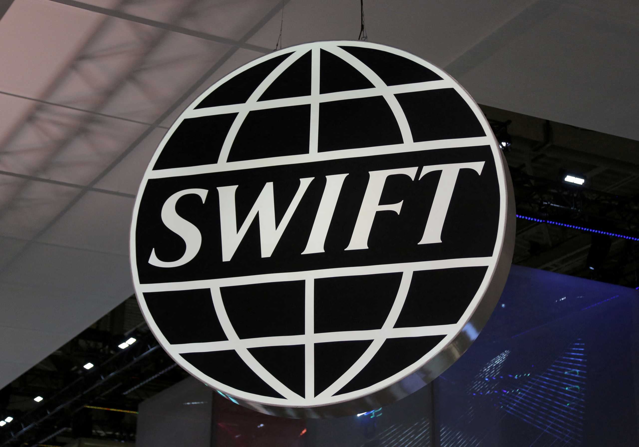 FILE PHOTO: The logo of global secure financial messaging services cooperative SWIFT is seen at the SIBOS banking and financial conference in Toronto, Ontario, Canada October 19, 2017.  REUTERS