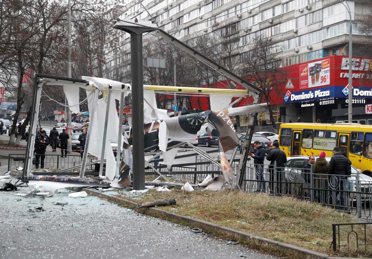 Debris and rubble are seen at the site where a missile landed in the street, after Russian President Vladimir Putin authorized a military operation in eastern Ukraine, in Kyiv, Ukraine February 24, 2022. REUTERS