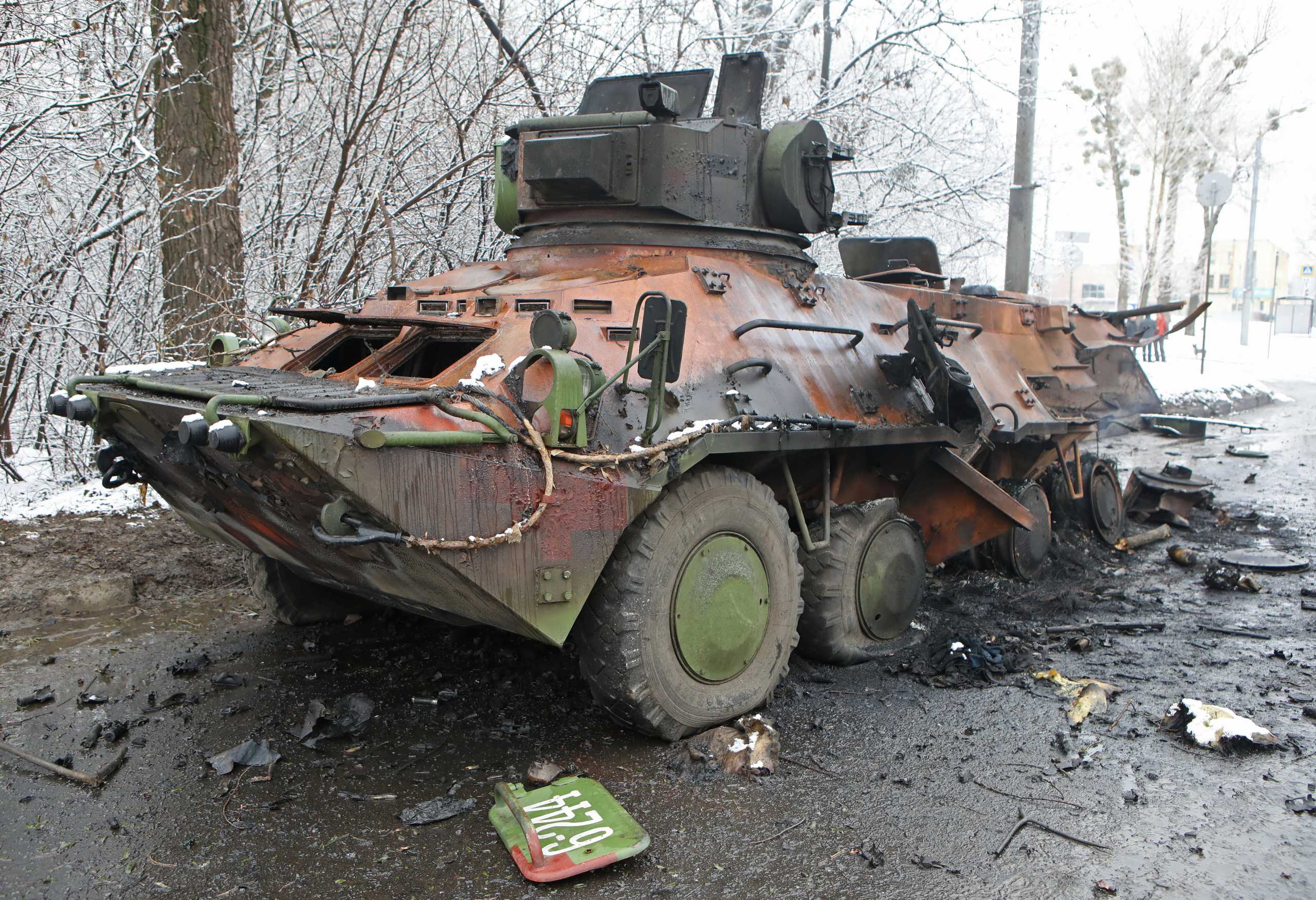 A view shows a destroyed armored personnel carrier (APC) on the roadside in Kharkiv, Ukraine February 26, 2022. REUTERS