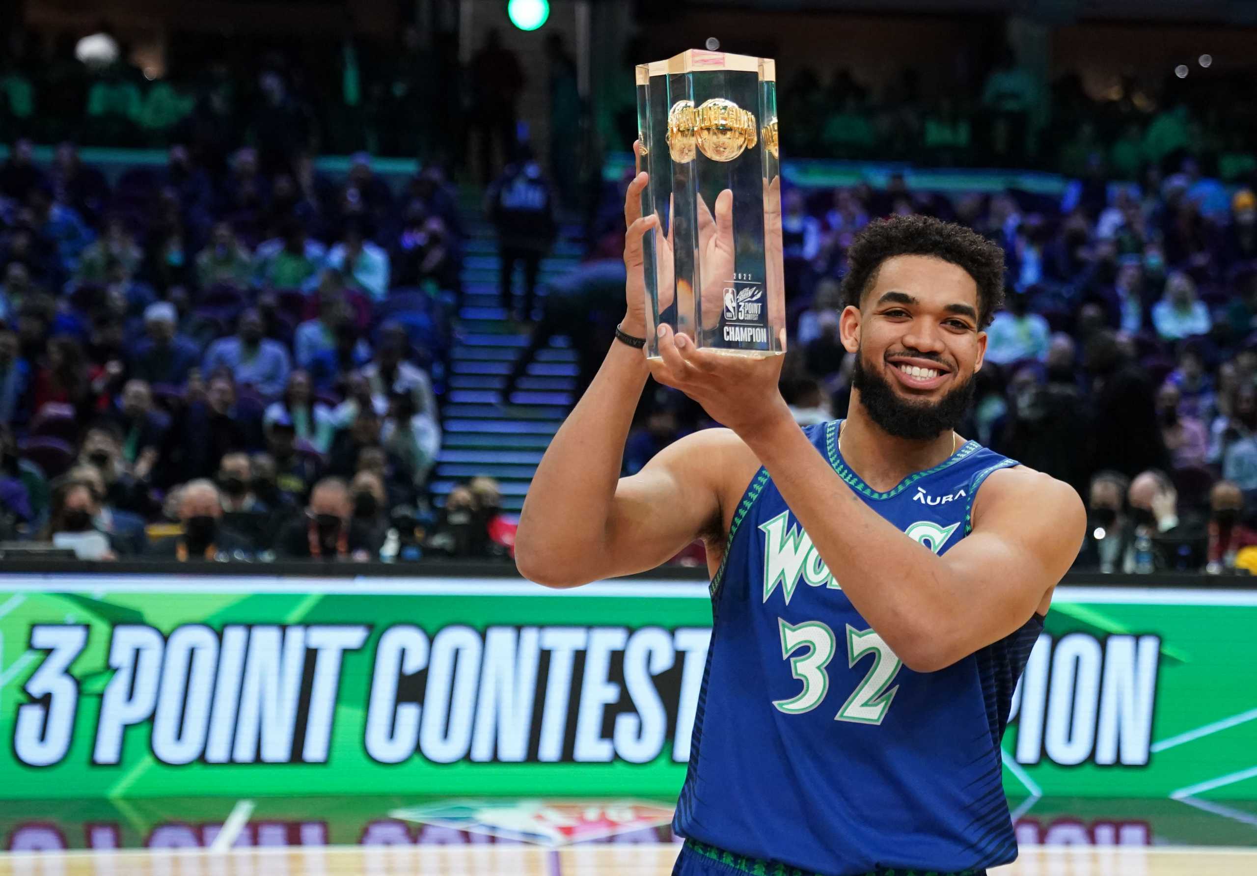 Feb 19, 2022; Cleveland, OH, USA; Minnesota Timberwolves center Karl-Anthony Towns (32) holds the trophy after winning the Skills Challenge during the 2022 NBA All-Star Saturday Night at Rocket Mortgage Field House. Mandatory Credit: Kyle Terada-USA TODAY Sports