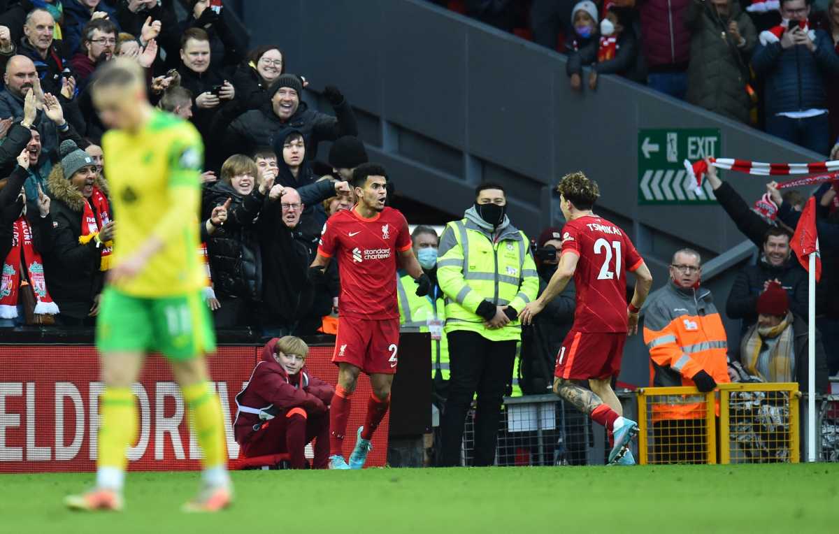 Soccer Football - Premier League - Liverpool v Norwich City - Anfield, Liverpool, Britain - February 19, 2022 Liverpool's Luis Diaz celebrates scoring their third goal with Kostas Tsimikas REUTERS