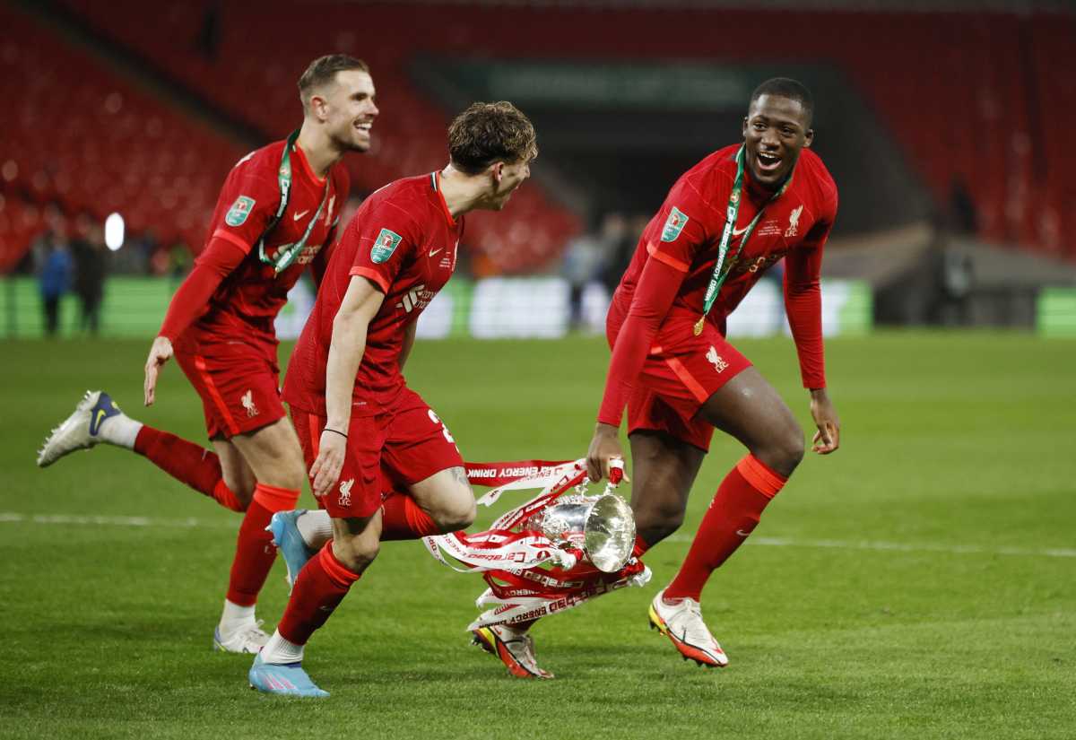 Soccer Football - Carabao Cup Final - Chelsea v Liverpool - Wembley Stadium, London, Britain - February  27, 2022  Liverpool's Jordan Henderson, Kostas Tsimikas and Ibrahima Konate celebrate with the trophy after winning the Carabao Cup Action Images via Reuters