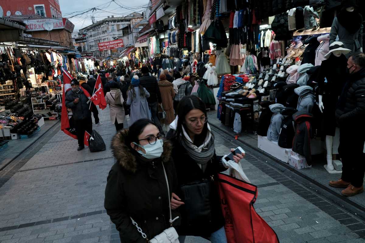People stroll at Mahmutpasa street, a middle-class shopping area, as the coronavirus disease (COVID-19) outbreak continues in Istanbul, Turkey, January 13, 2022. REUTERS