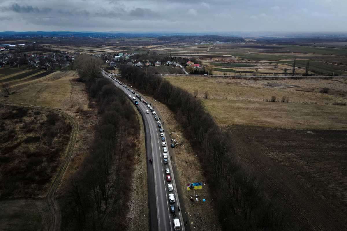 Cars line up on the road to the Shehyni border crossing as people flee to Poland, after Russia launched a massive military operation against Ukraine, outside Mostyska, Ukraine, February 27, 2022. Picture taken with a drone.  REUTERS