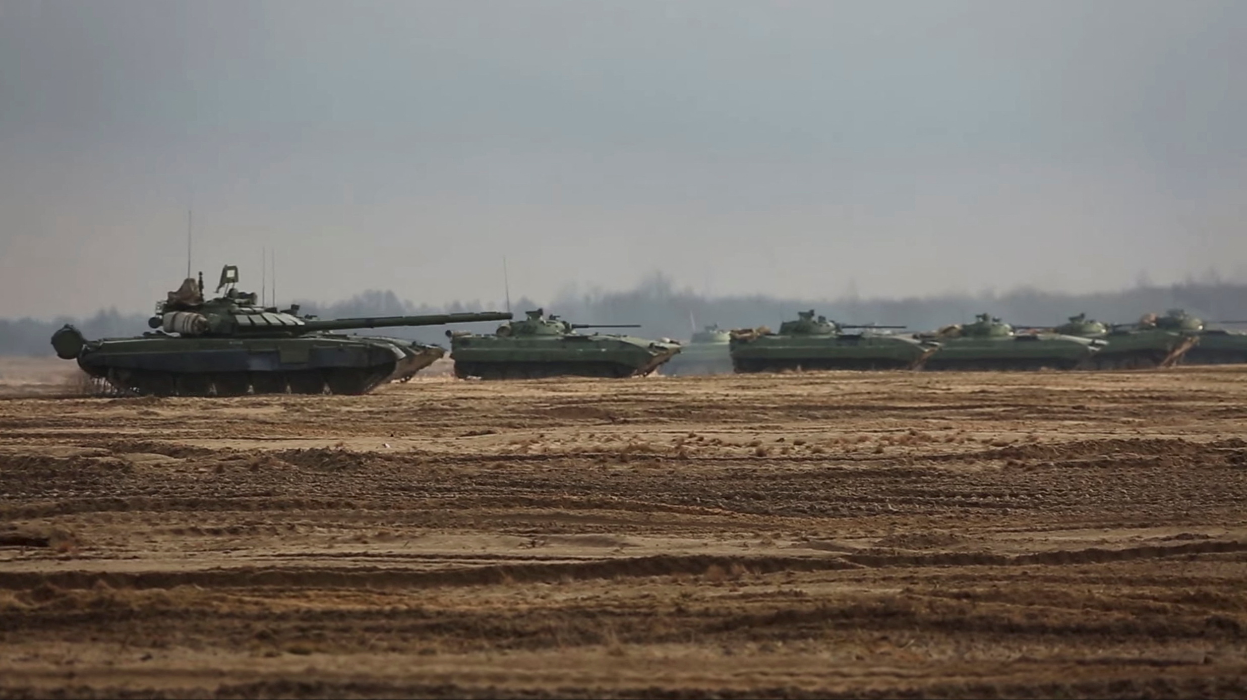 Military vehicles drive during the Union Courage 2022 joint military exercise of the armed forces of Russia and Belarus, at the Brestsky training ground in Brest Region, Belarus, in this still image taken from video released February 11, 2022. Russian Defence Ministry