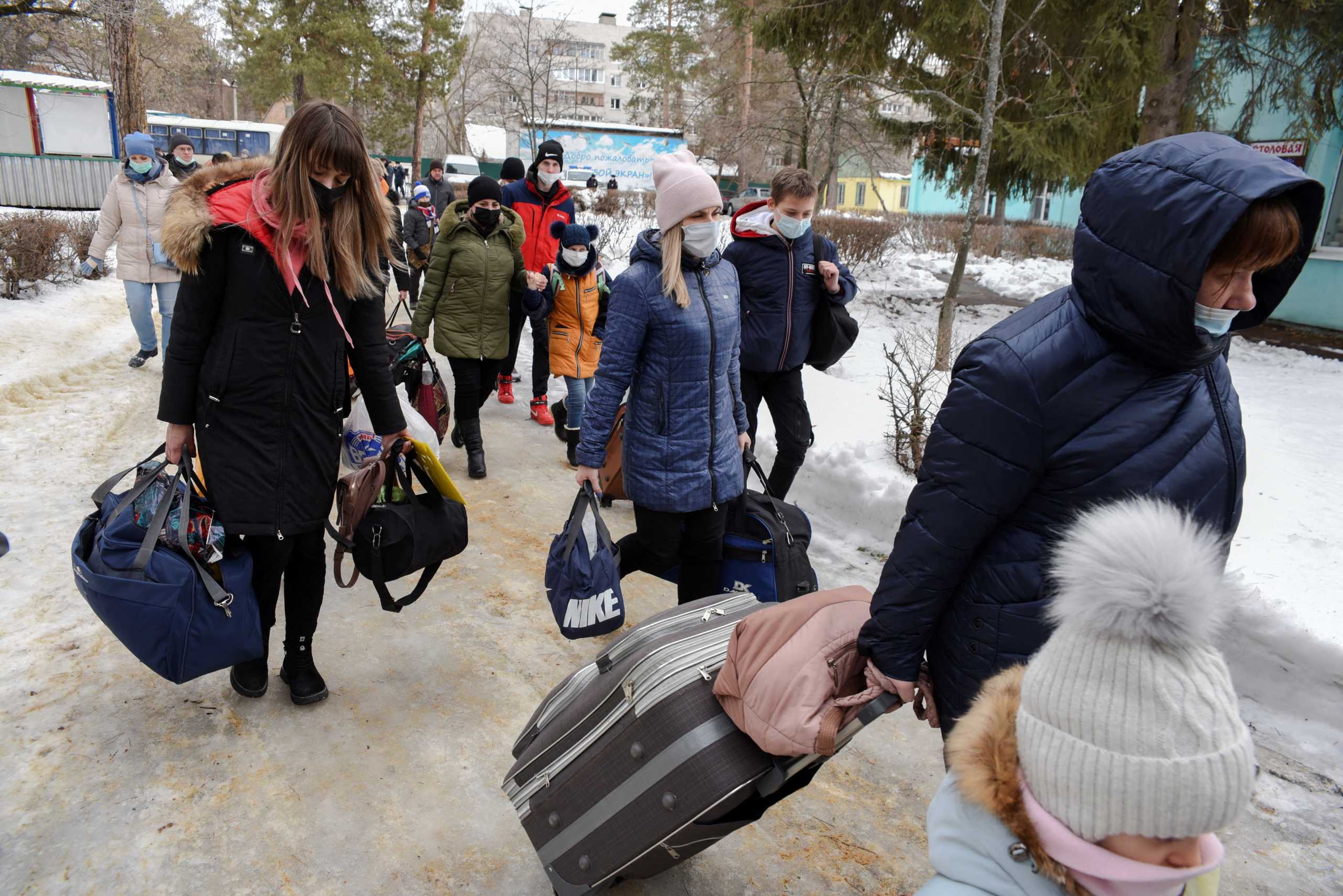 Evacuees from the separatist-controlled regions of eastern Ukraine arrive at a temporary accommodation centre on the outskirts of Voronezh, Russia February 20, 2022. REUTERS