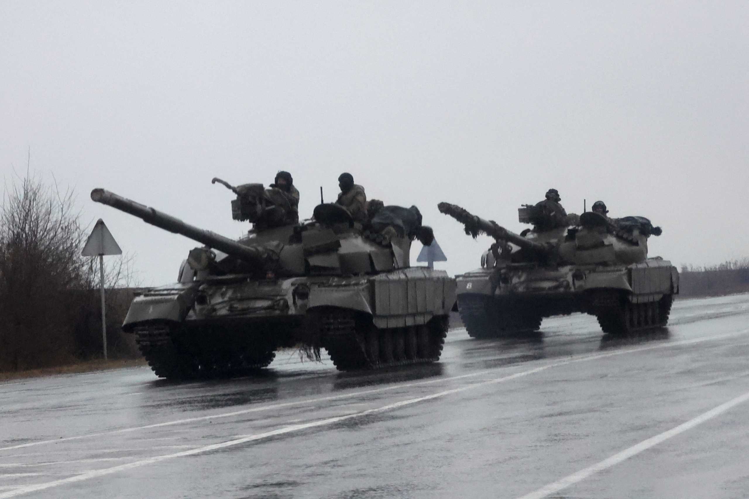 Tanks move into the city, after Russian President Vladimir Putin authorized a military operation in eastern Ukraine, in Mariupol, February 24, 2022. REUTERS