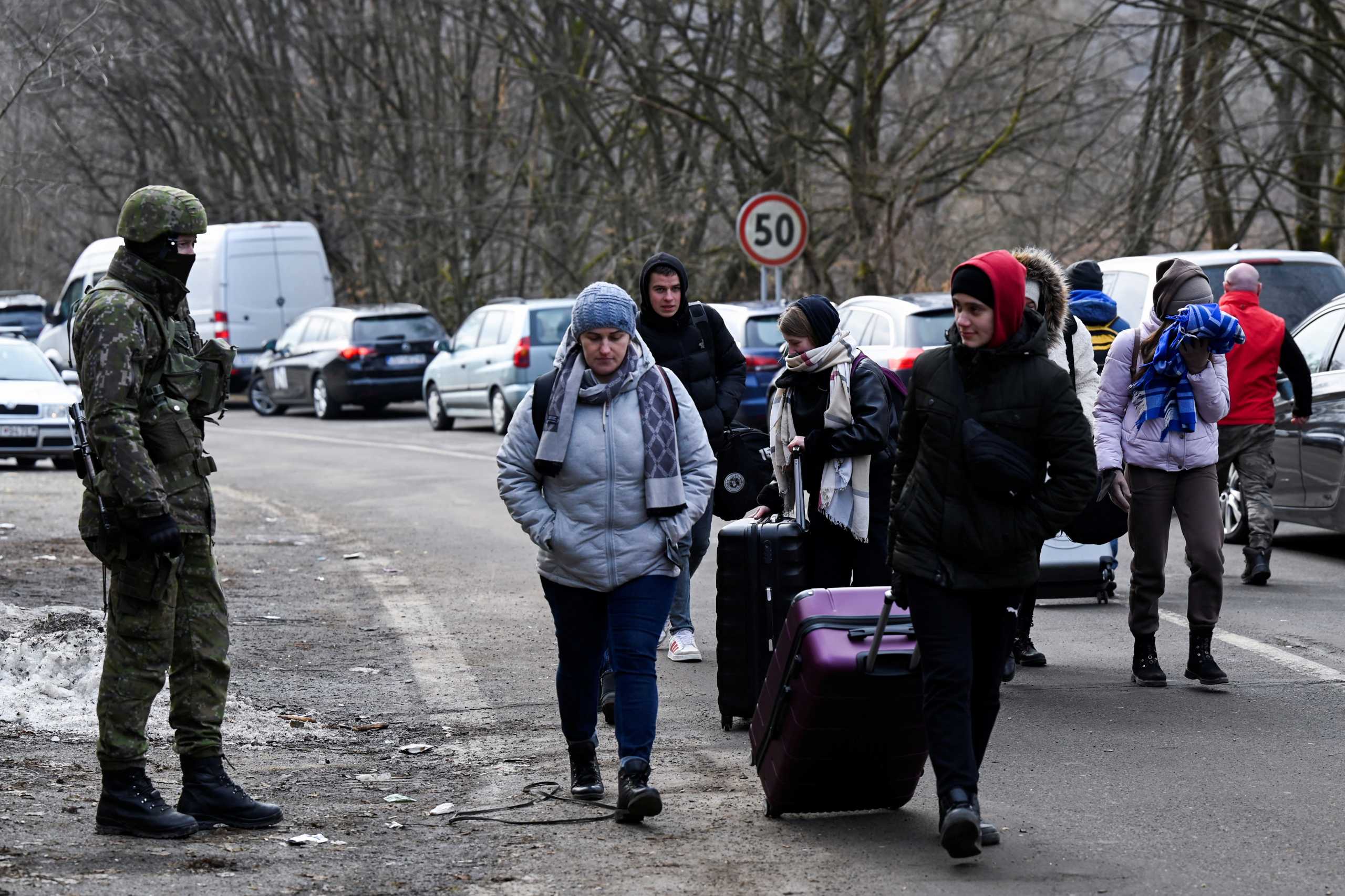 People fleeing from Ukraine arrive in Slovakia, after Russia launched a massive military operation against Ukraine, in Ubla, Slovakia, February 26, 2022. REUTERS