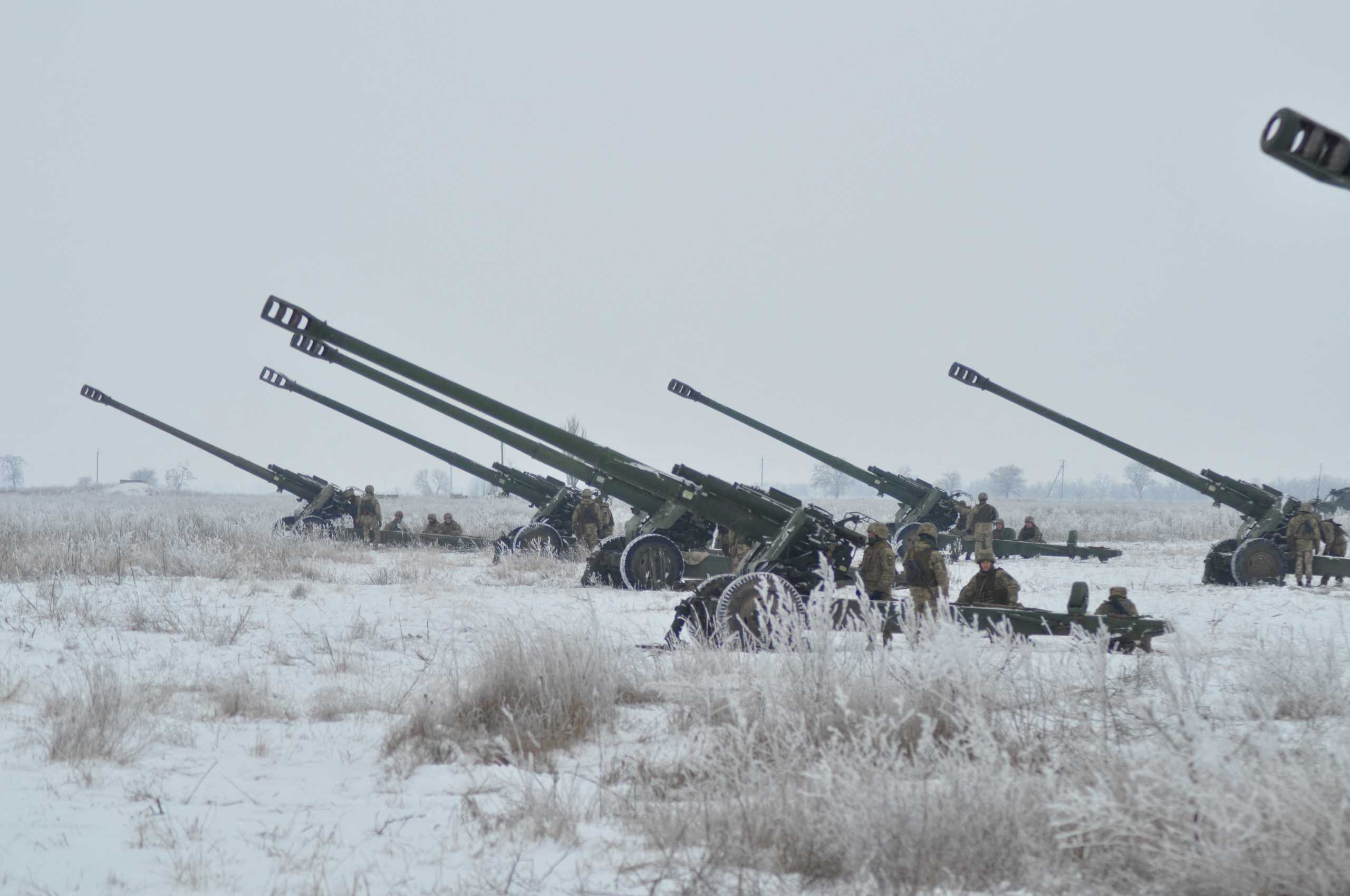 Ukrainian service members operate 2A65 Msta-B howitzers during artillery and anti-aircraft drills near the border with Russian-annexed Crimea in the Kherson region, Ukraine, in this handout picture released January 28, 2022. Press Service of the Joint Forces Operation