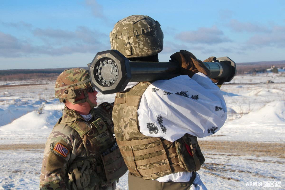 U.S. army instructor from the Joint Multinational Training Group trains a Ukrainian service member to operate with M141 Bunker Defeat Munition (SMAW-D) grenade launcher, supplied by the United States, at a shooting range in Lviv Region, Ukraine, in this handout picture released January 30, 2022. The Ukrainian Ground Forces