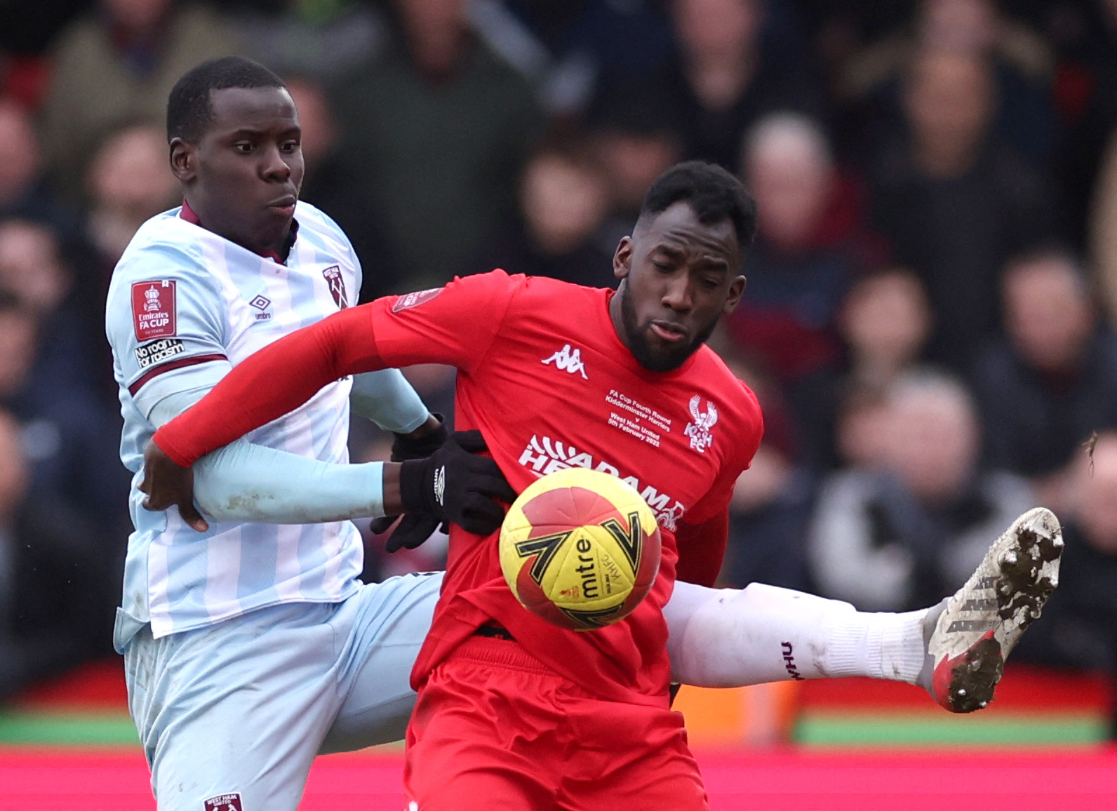 Soccer Football -  FA Cup - Fourth Round - Kidderminster Harriers v West Ham United - Aggborough Stadium, Kidderminster, Britain - February 5, 2022  Kidderminster Harriers' Amari Morgan-Smith in action with West Ham United's Kurt Zouma Action Images via Reuters