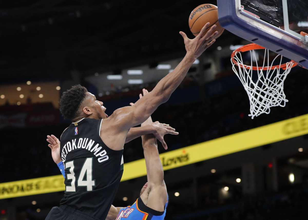 Mar 8, 2022; Oklahoma City, Oklahoma, USA; Milwaukee Bucks forward Giannis Antetokounmpo (34) goes to the basket against Oklahoma City Thunder forward Isaiah Roby (22) during the second half at Paycom Center. Milwaukee won 142-115. Mandatory Credit: Alonzo Adams-USA TODAY Sports