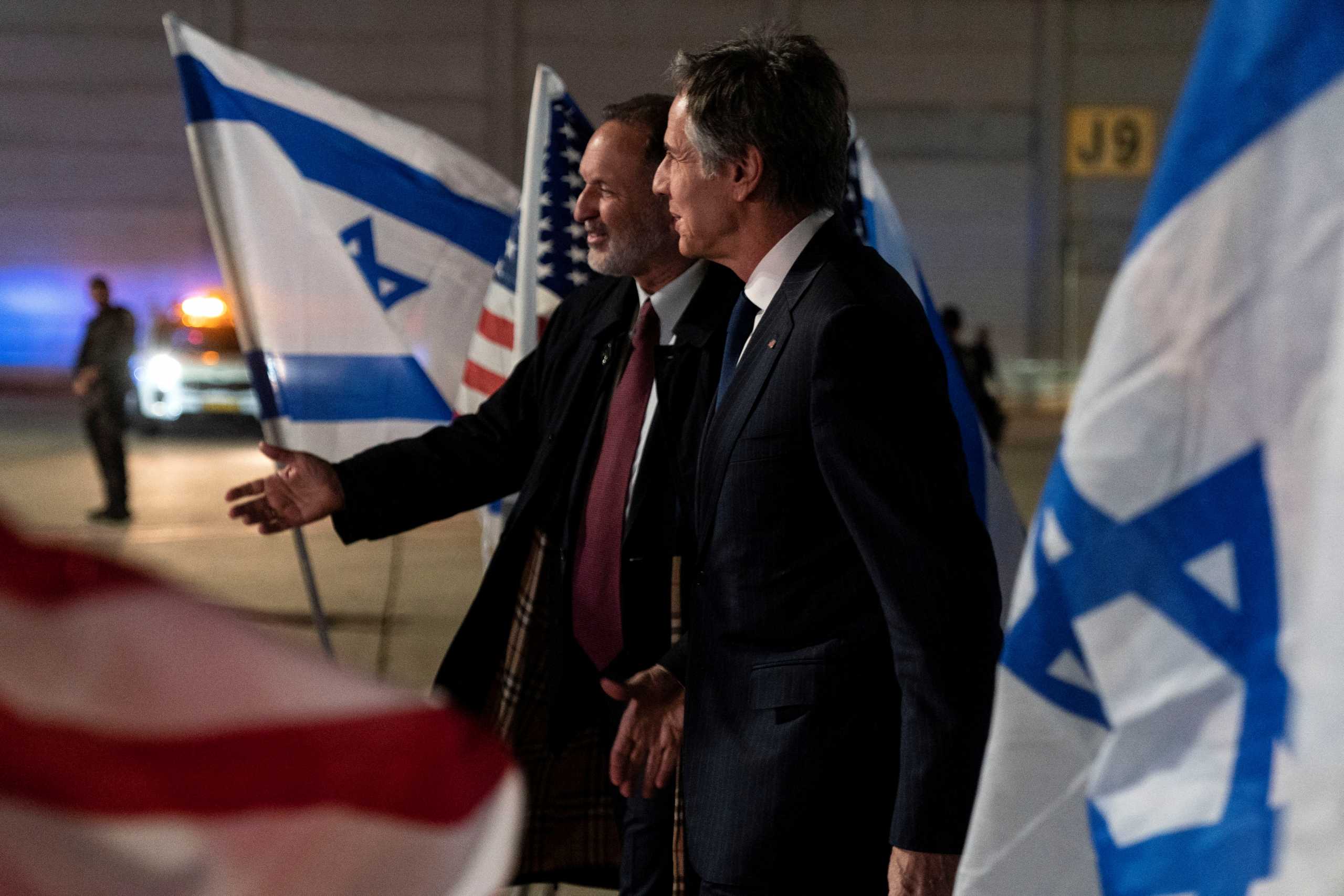 U.S. Secretary of State Antony Blinken, right, walks with Israel's Chief of State Protocol, Gil Haskel, as he arrives at Ben Gurion Airport, near Tel Aviv, Israel March 26, 2022. Jacquelyn Martin