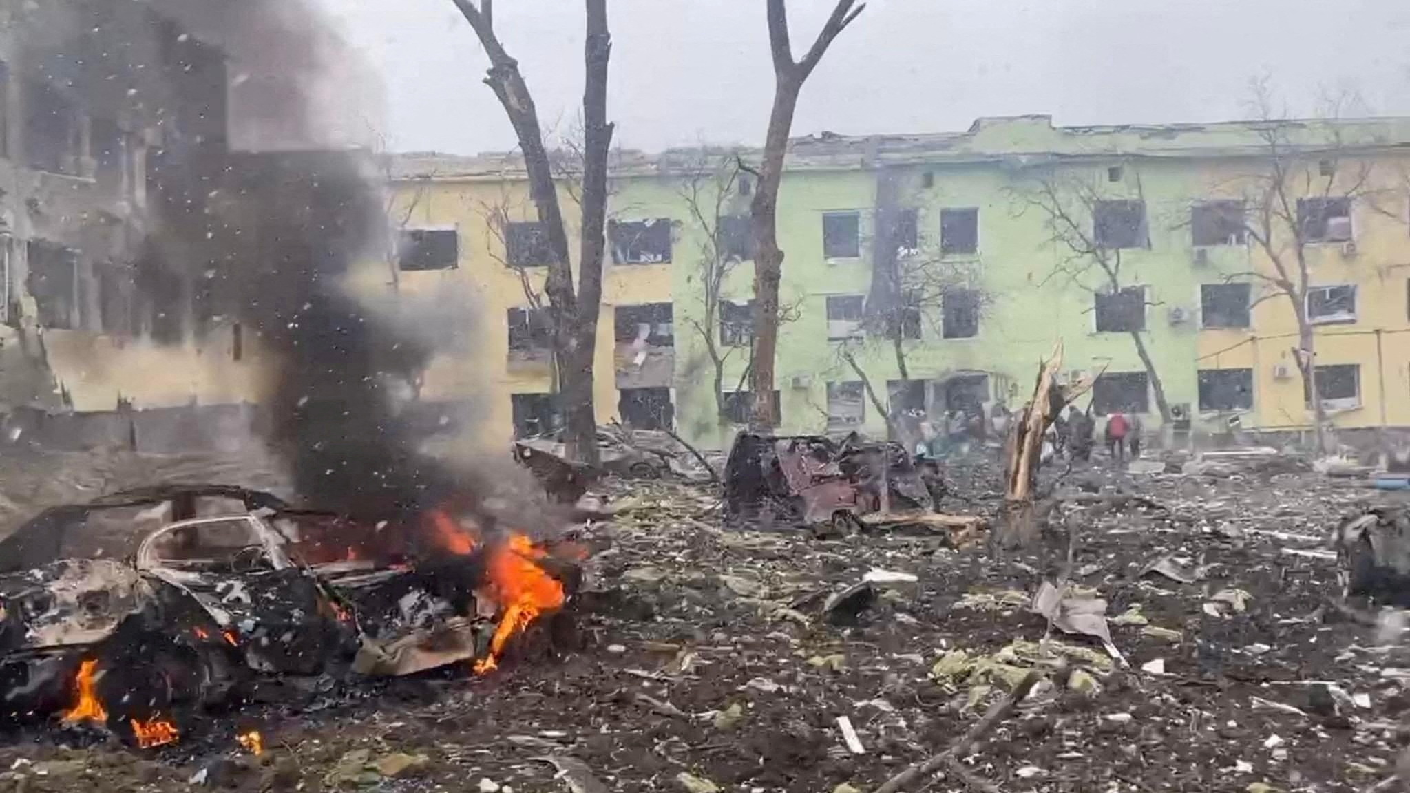 A view shows cars and a building of a hospital destroyed by an aviation strike amid Russia's invasion of Ukraine, in Mariupol, Ukraine, in this handout picture released March 9, 2022.  Press service of the National Police of Ukraine