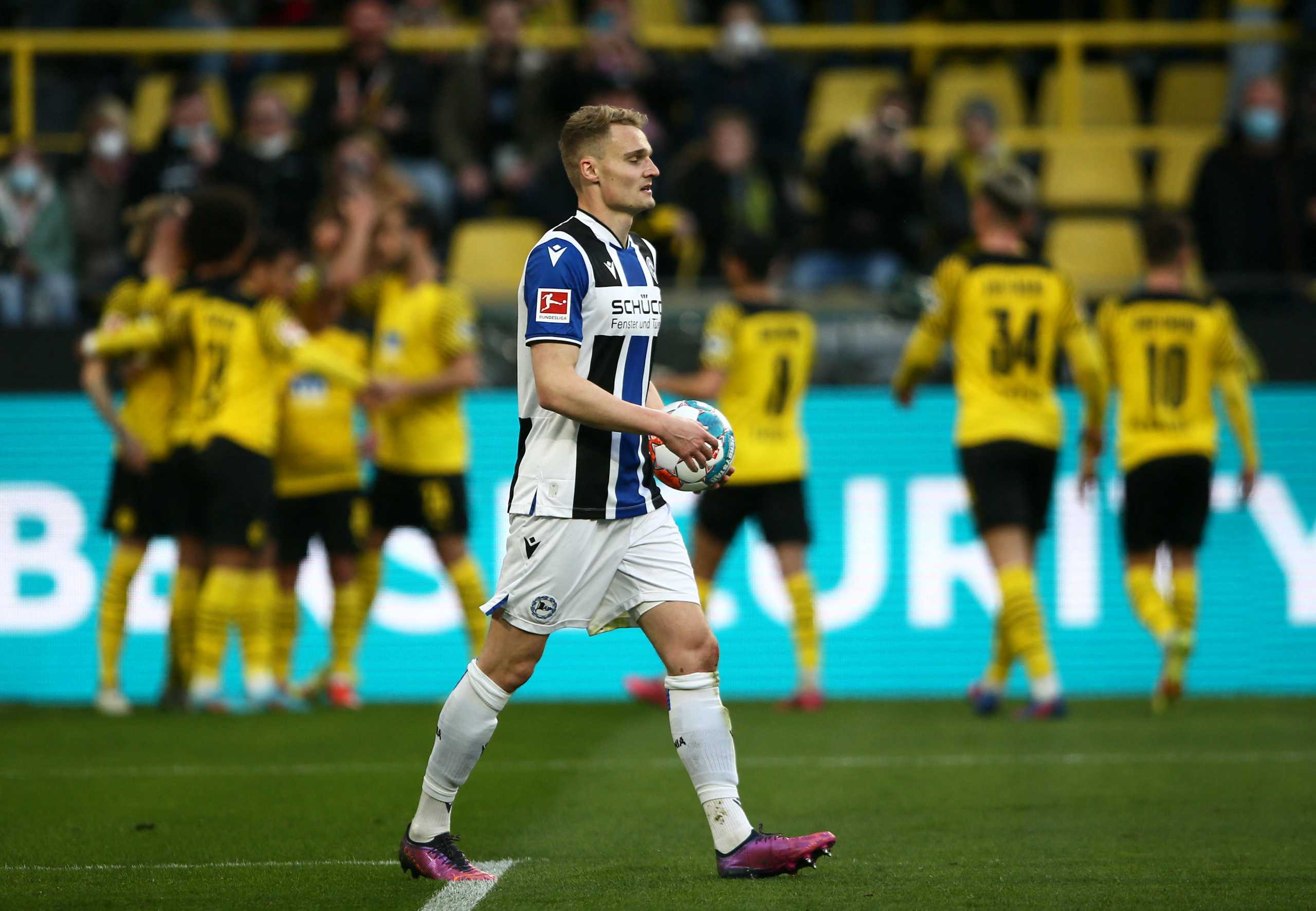 Soccer Football - Bundesliga - Borussia Dortmund v Arminia Bielefeld - Signal Iduna Park, Dortmund, Germany - March 13, 2022 Arminia Bielefeld's Amos Pieper looks dejected after Borussia Dortmund scores their first goal REUTERS