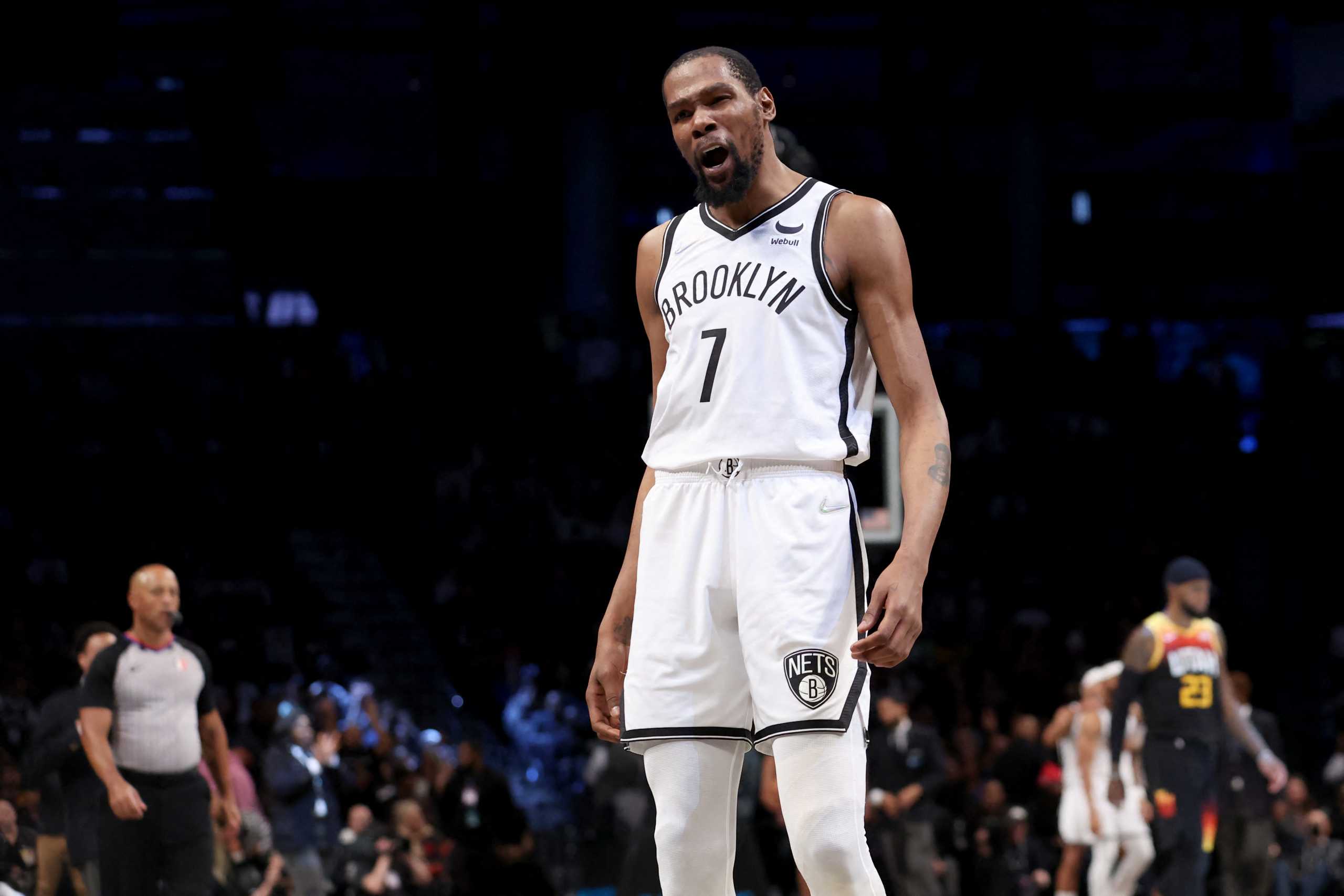 Mar 21, 2022; Brooklyn, New York, USA; Brooklyn Nets forward Kevin Durant (7) talks to a fan during the fourth quarter against the Utah Jazz at Barclays Center. Mandatory Credit: Brad Penner-USA TODAY Sports