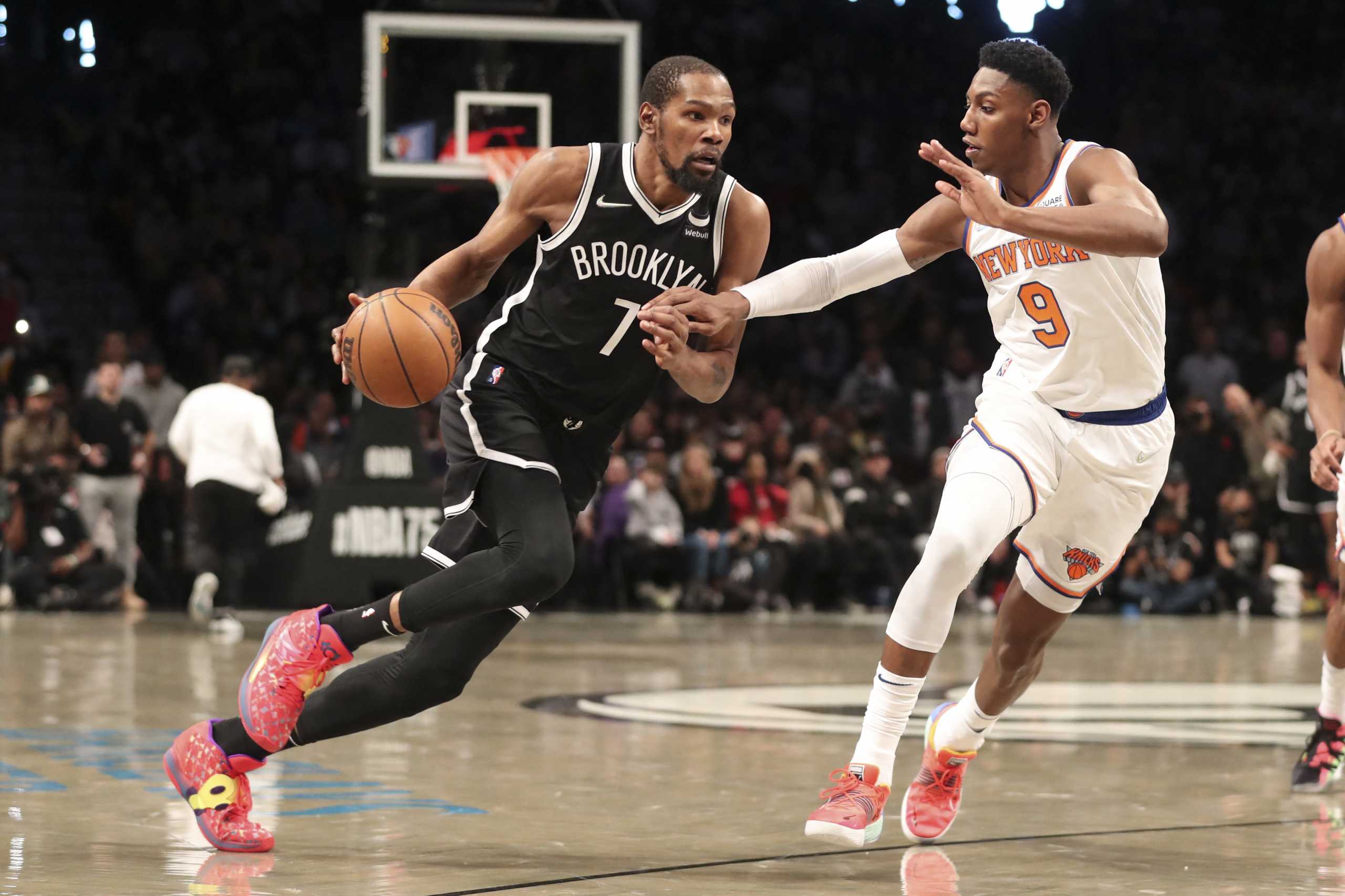 Mar 13, 2022; Brooklyn, New York, USA;  Brooklyn Nets forward Kevin Durant (7) drives against New York Knicks guard RJ Barrett (9) in the fourth quarter at Barclays Center. Mandatory Credit: Wendell Cruz-USA TODAY Sports