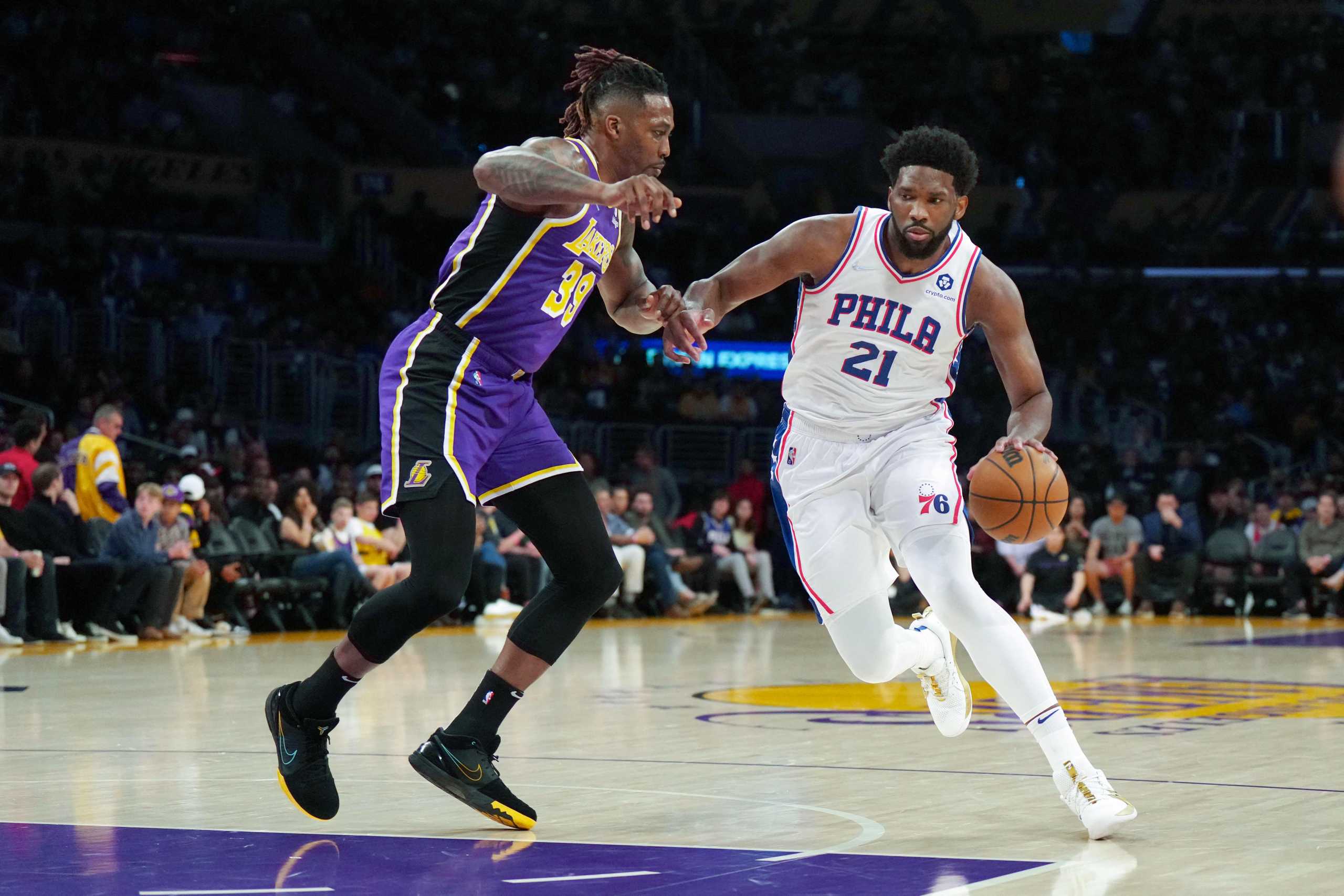 Mar 23, 2022; Los Angeles, California, USA; Philadelphia 76ers center Joel Embiid (21) is defended by Los Angeles Lakers center Dwight Howard (39) in the first half at Crypto.com Arena. Mandatory Credit: Kirby Lee-USA TODAY Sports